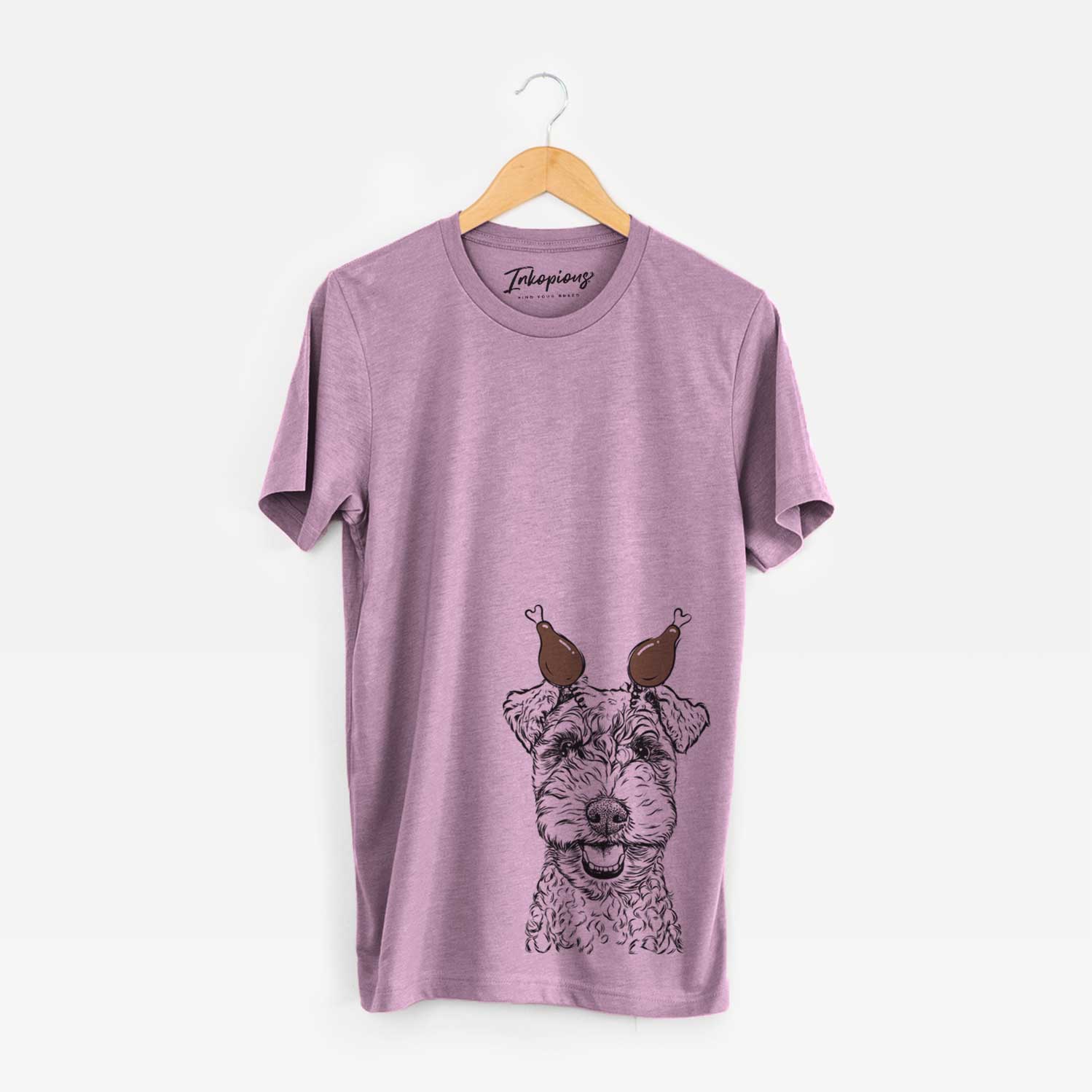 Hand-drawn sketch of Fintan the Irish Troodle with a Thanksgiving turkey headpiece on an Orchid Unisex crewneck