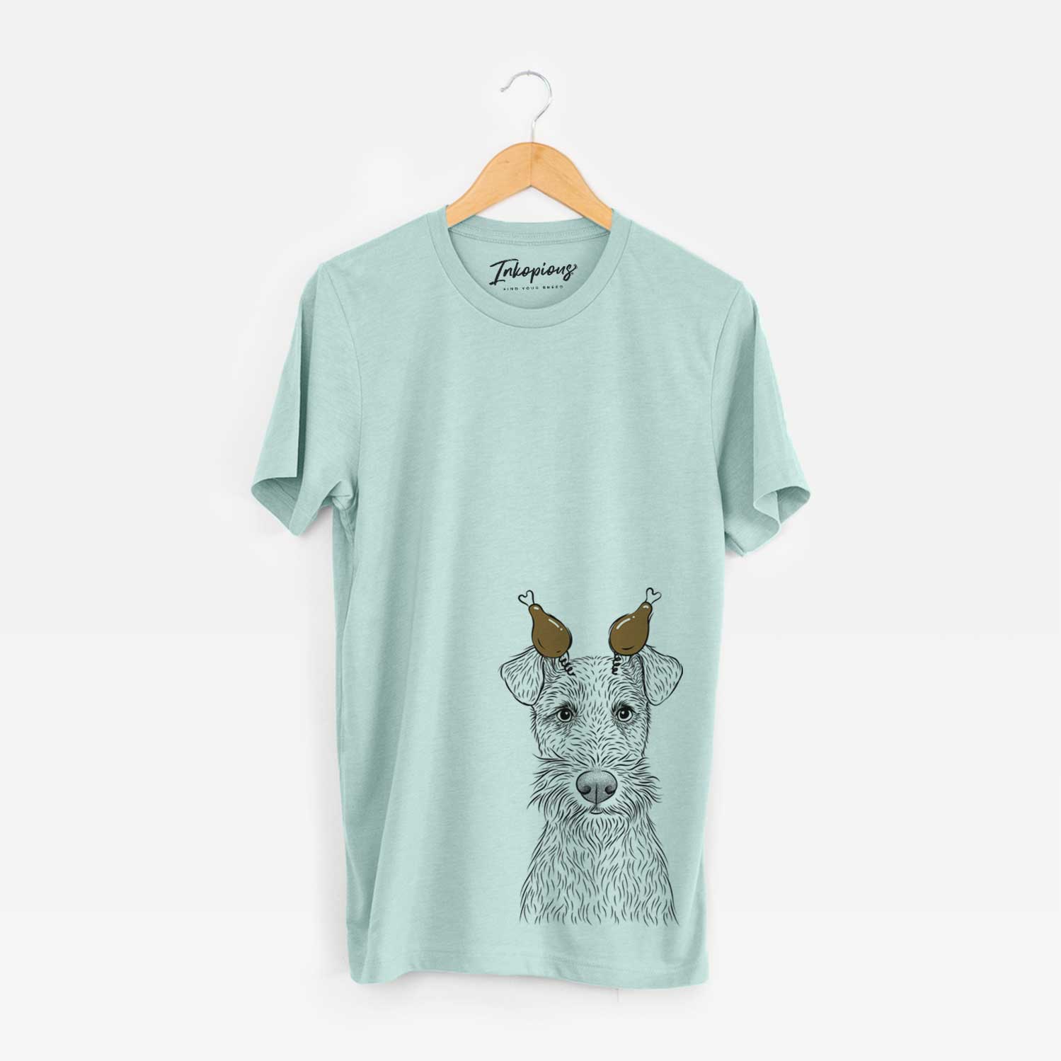 Hand-drawn sketch of Fitz the Wire Fox Terrier with a Thanksgiving turkey headpiece on a Heather Sage Unisex crewneck
