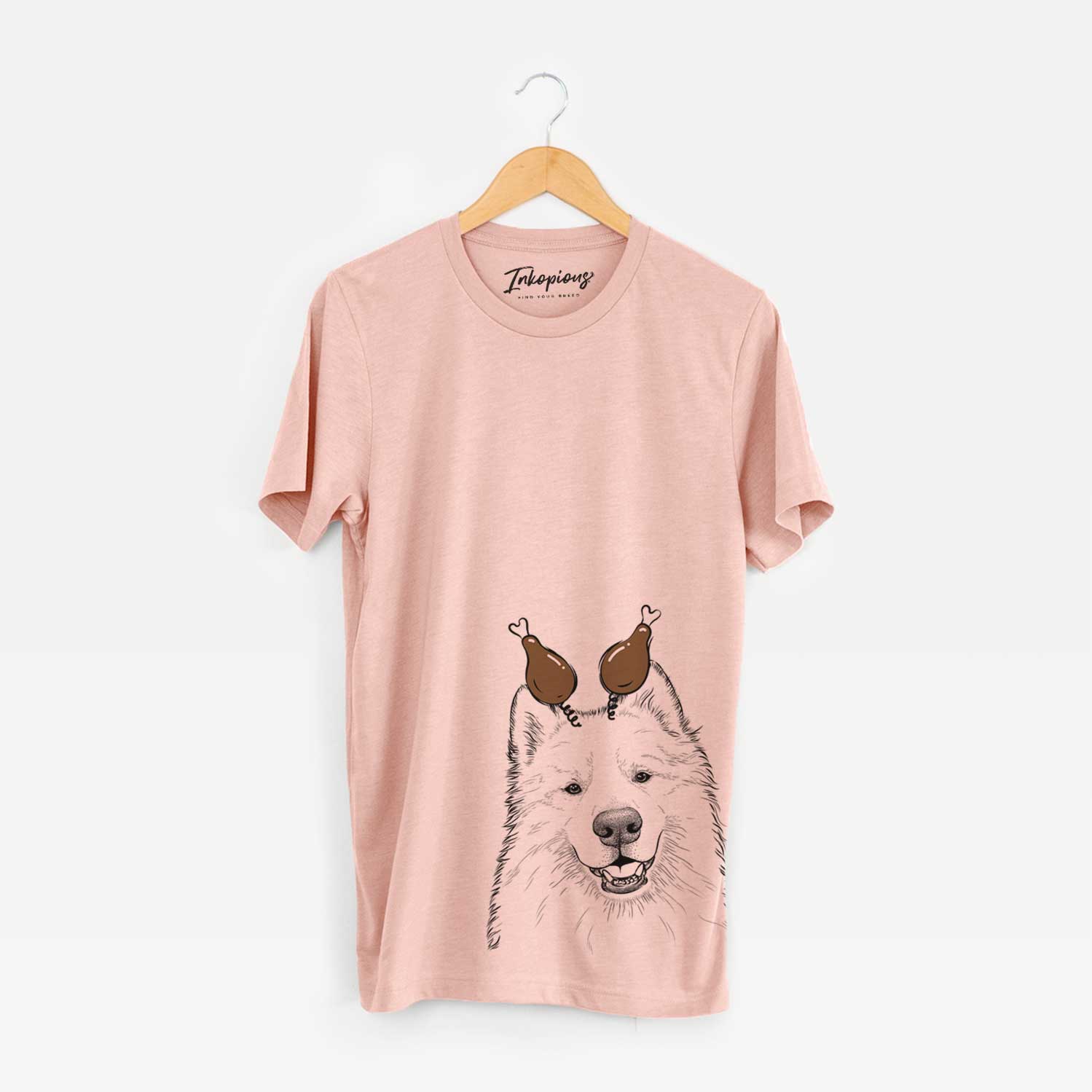 Hand-drawn sketch of Foster the Samoyed with a Thanksgiving turkey headpiece on a Peach Unisex crewneck
