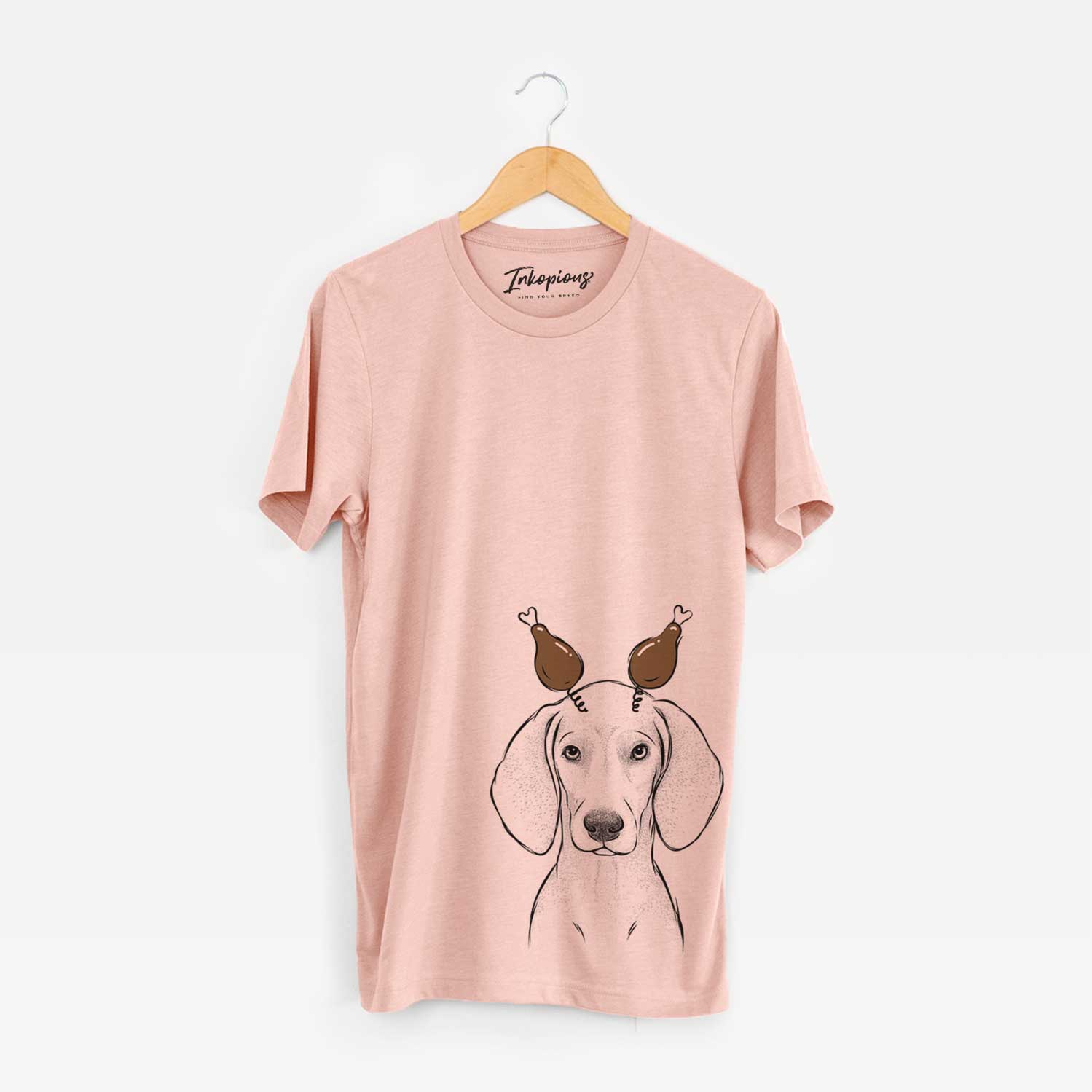 Hand-drawn sketch of Frejya the Weimaraner with a Thanksgiving turkey headpiece on a Peach Unisex crewneck
