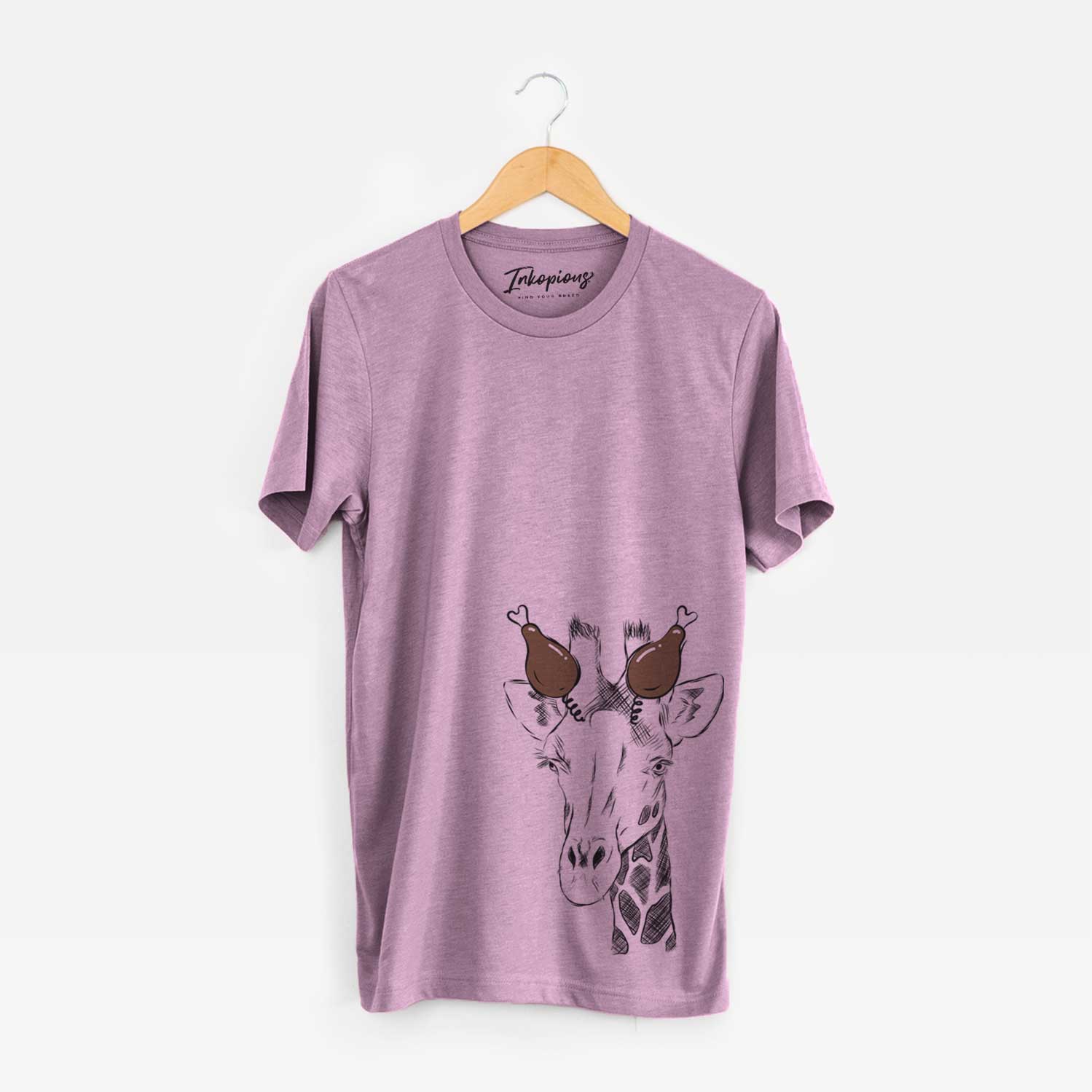 Hand-drawn sketch of Geoffrey the Giraffe with a Thanksgiving turkey headpiece on an Orchid Unisex crewneck