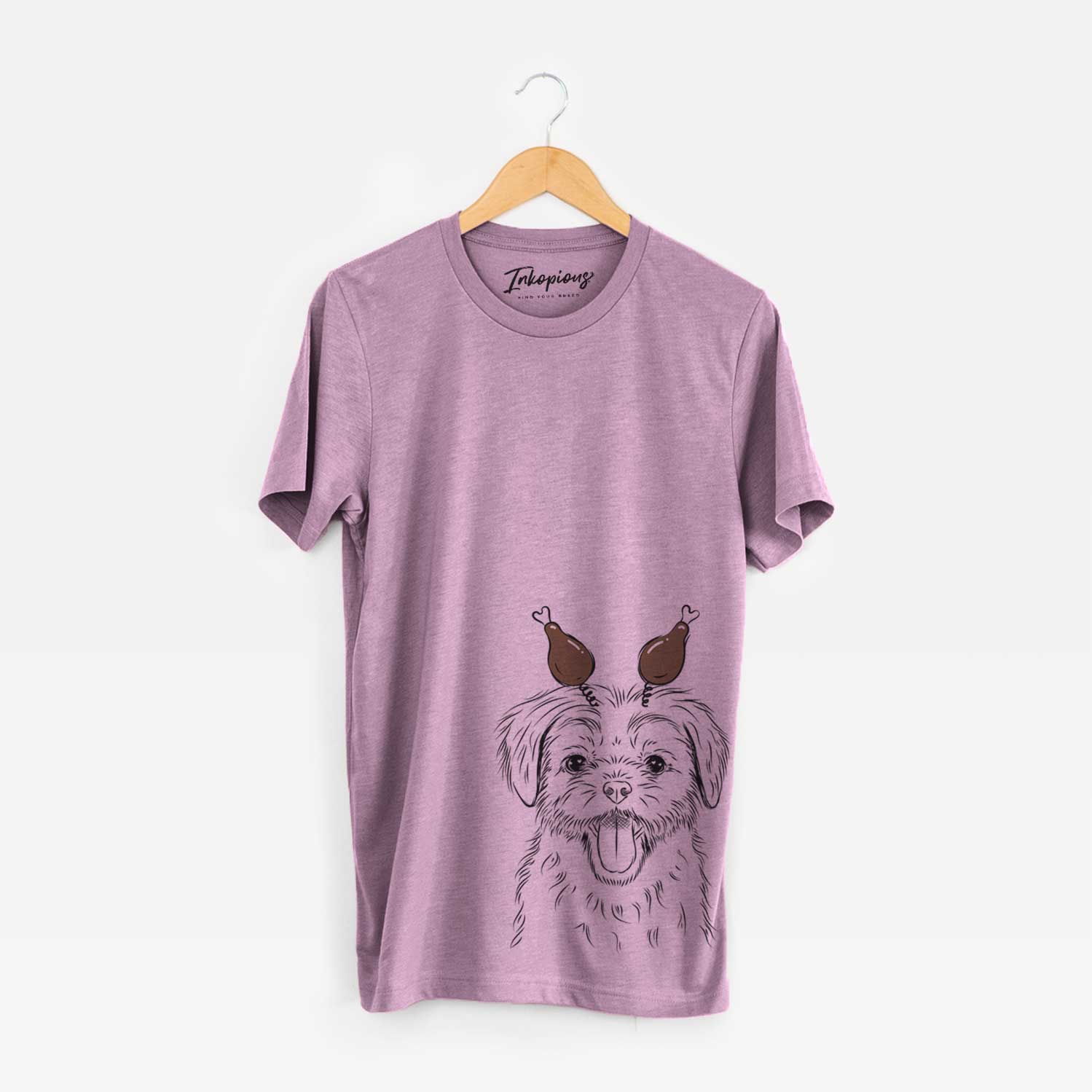 Hand-drawn sketch of Gizmo the Maltese with a Thanksgiving turkey headpiece on an Orchid Unisex crewneck