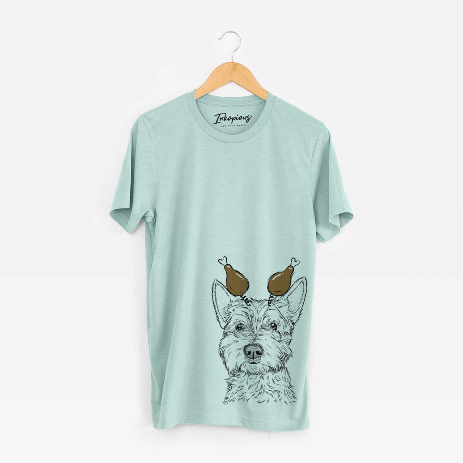 Hand-drawn sketch of Grizel the West Highland Terrier with a Thanksgiving turkey headpiece on a Heather Sage Unisex crewneck