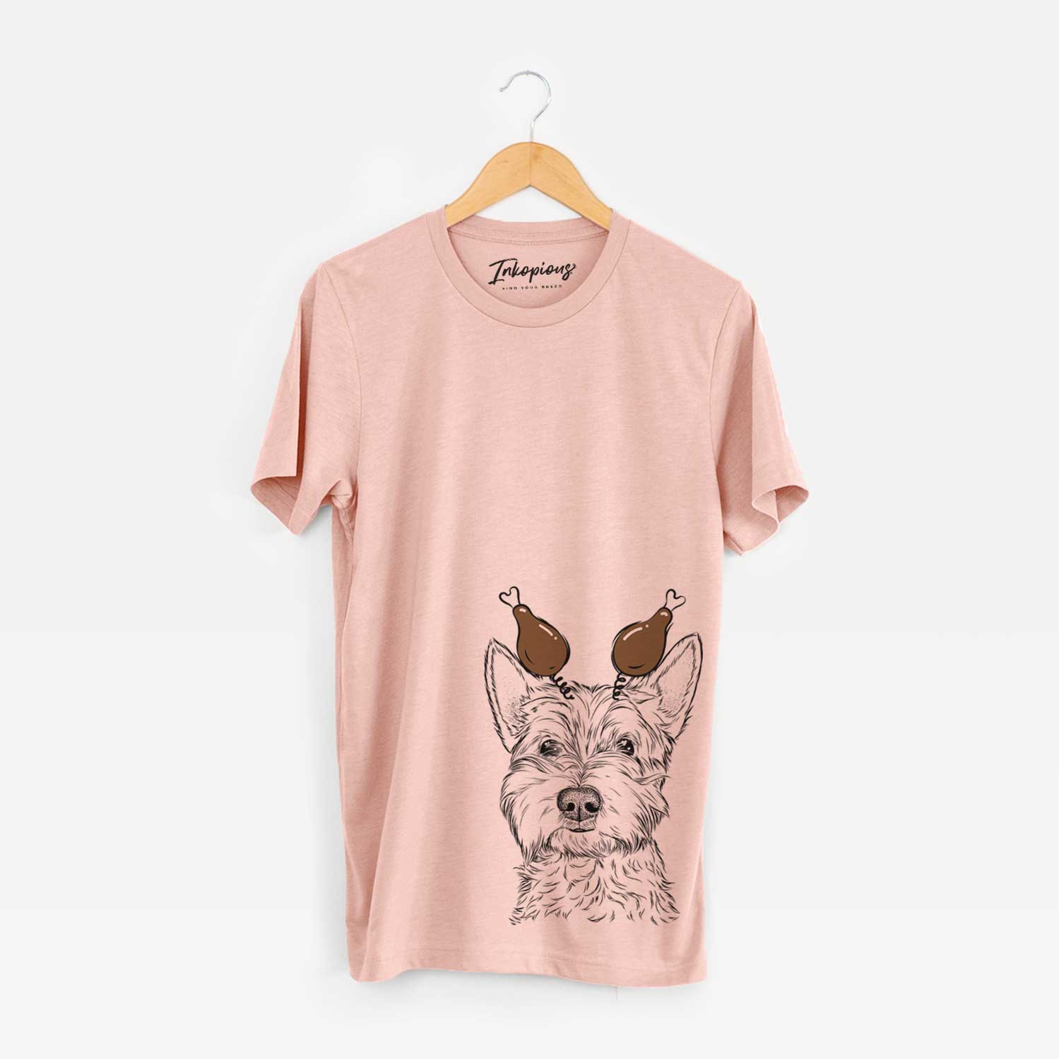 Hand-drawn sketch of Grizel the West Highland Terrier with a Thanksgiving turkey headpiece on a Peach Unisex crewneck