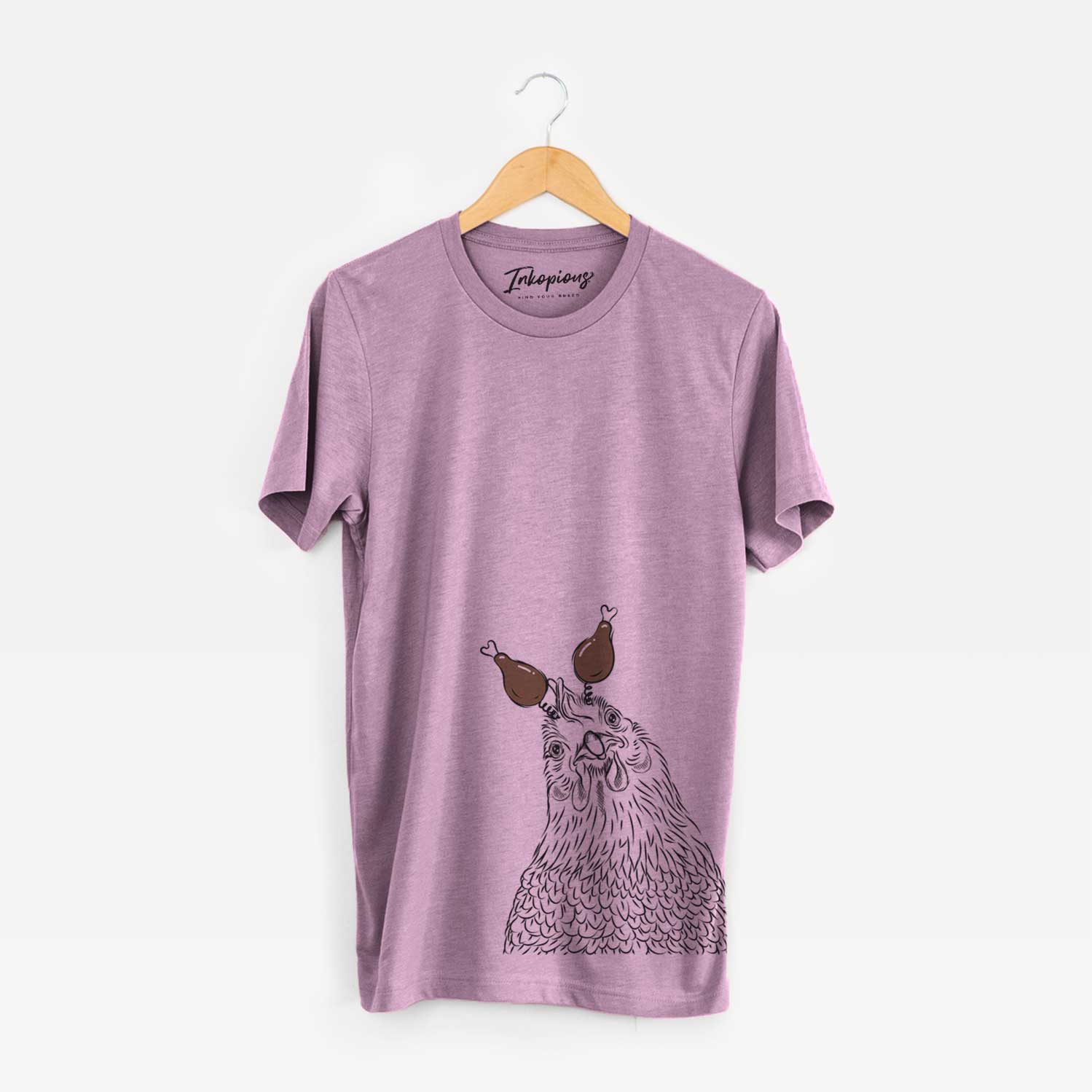 Hand-drawn sketch of Henrietta the Chicken with a Thanksgiving turkey headpiece on an Orchid Unisex crewneck