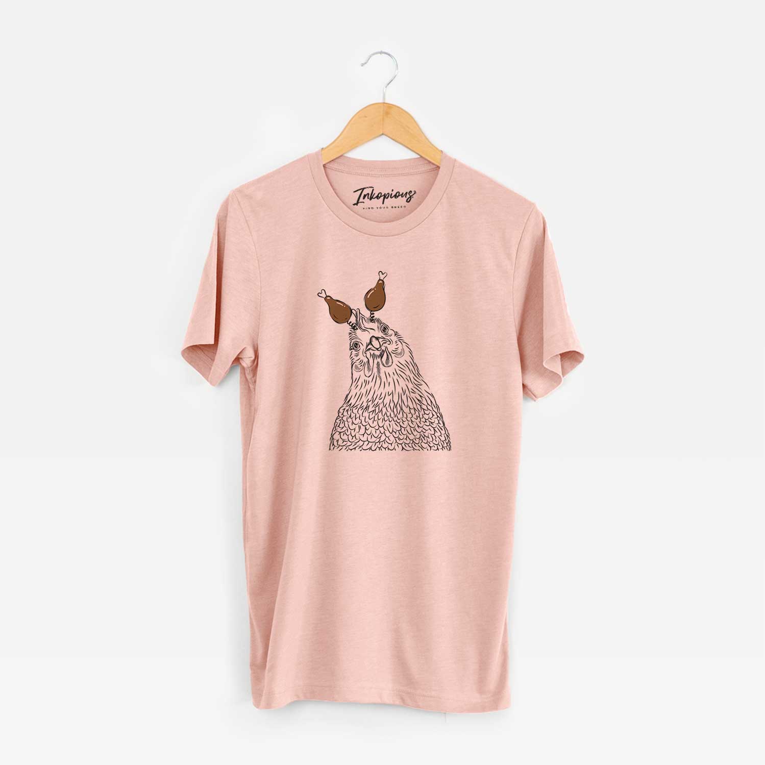 Hand-drawn sketch of Henrietta the Chicken with a Thanksgiving turkey headpiece on a Peach Unisex crewneck