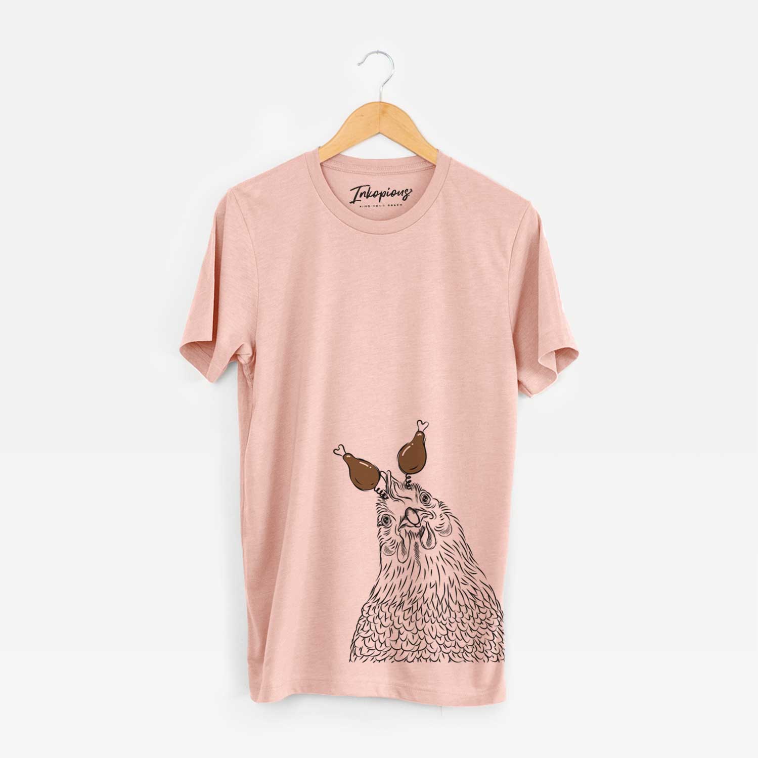 Hand-drawn sketch of Henrietta the Chicken with a Thanksgiving turkey headpiece on a Peach Unisex crewneck
