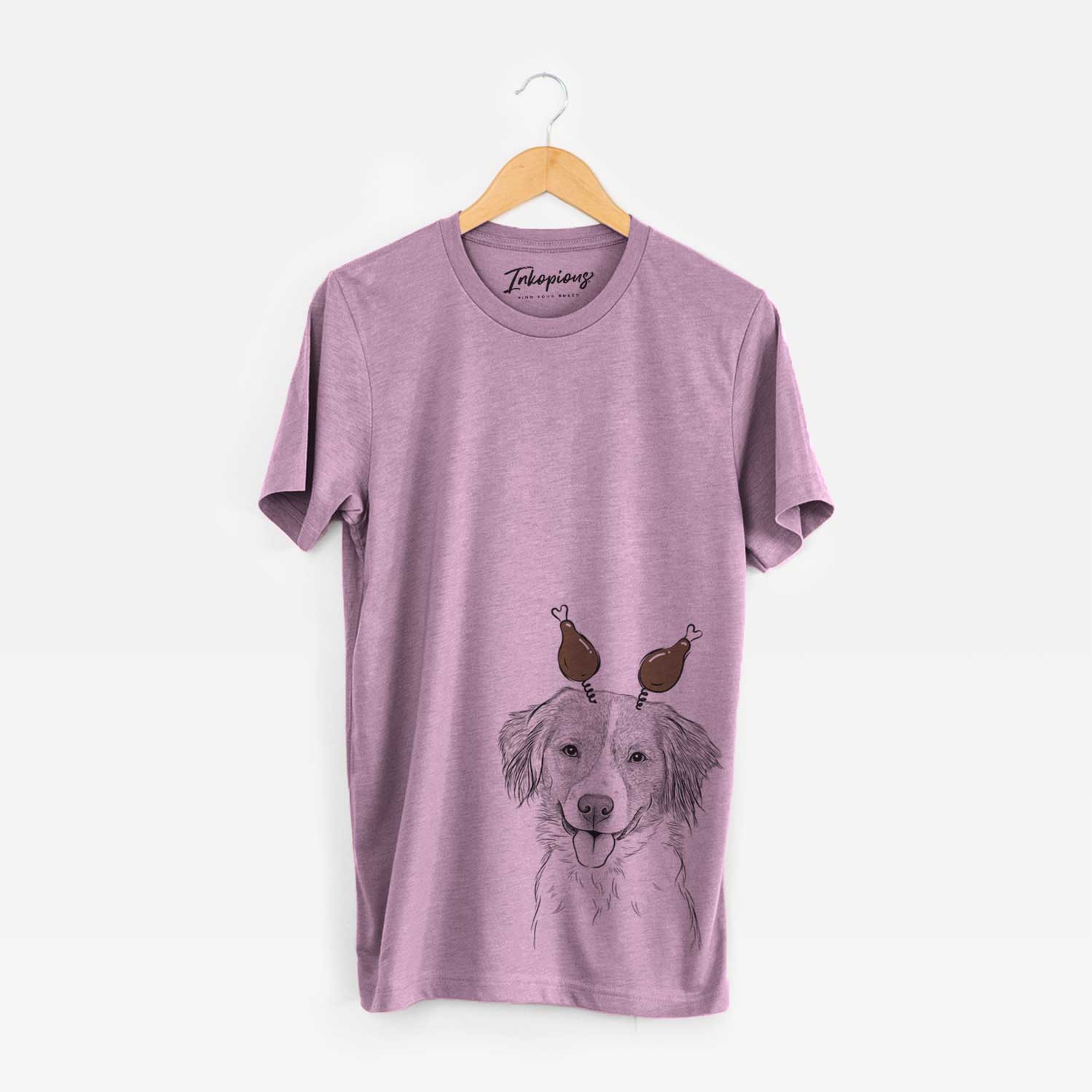 Hand-drawn sketch of Hercules the Nederlandse Kooikerhondje with a Thanksgiving turkey headpiece on an Orchid Unisex crewneck