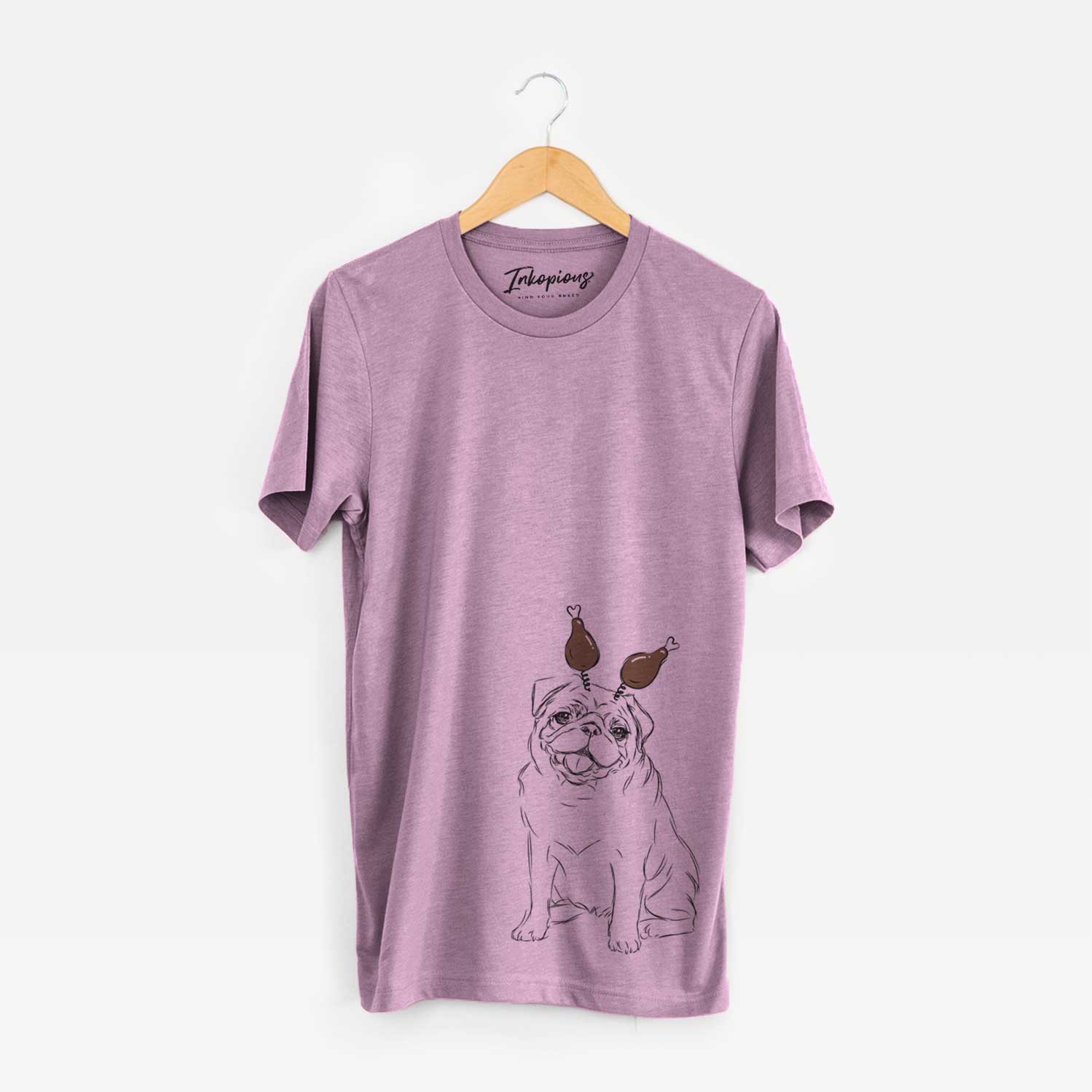 Hand-drawn sketch of Higgins the Pug with a Thanksgiving turkey headpiece on an Orchid Unisex crewneck