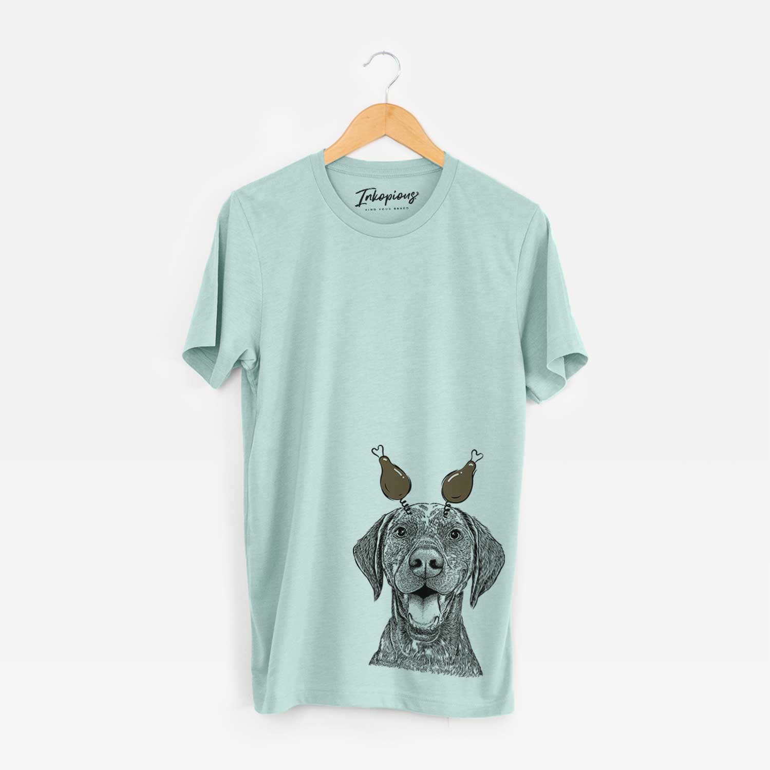 Hand-drawn sketch of Hudson the German Shorthaired Pointer with a Thanksgiving turkey headpiece on a Heather Sage Unisex crewneck