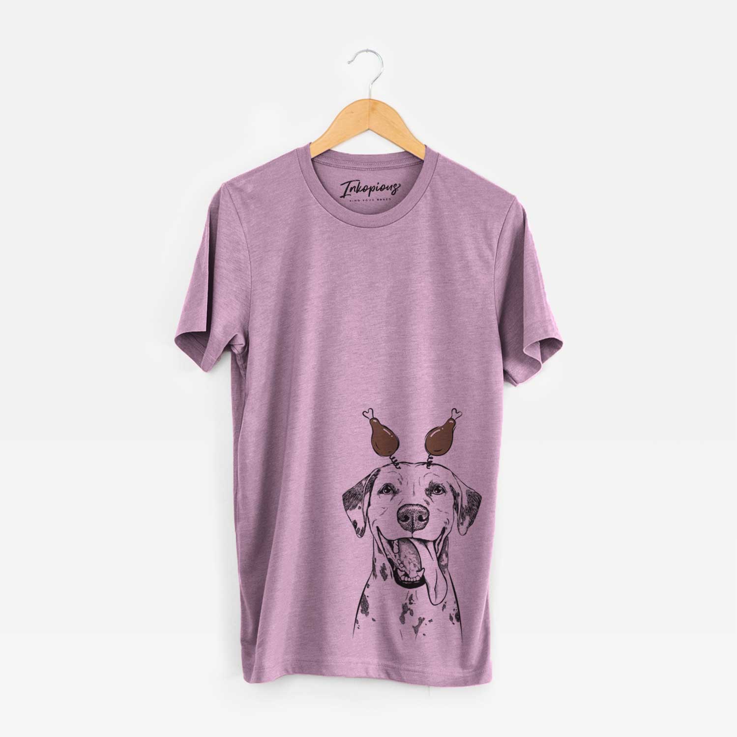 Hand-drawn sketch of Hydro the Dalmatian with a Thanksgiving turkey headpiece on an Orchid Unisex crewneck