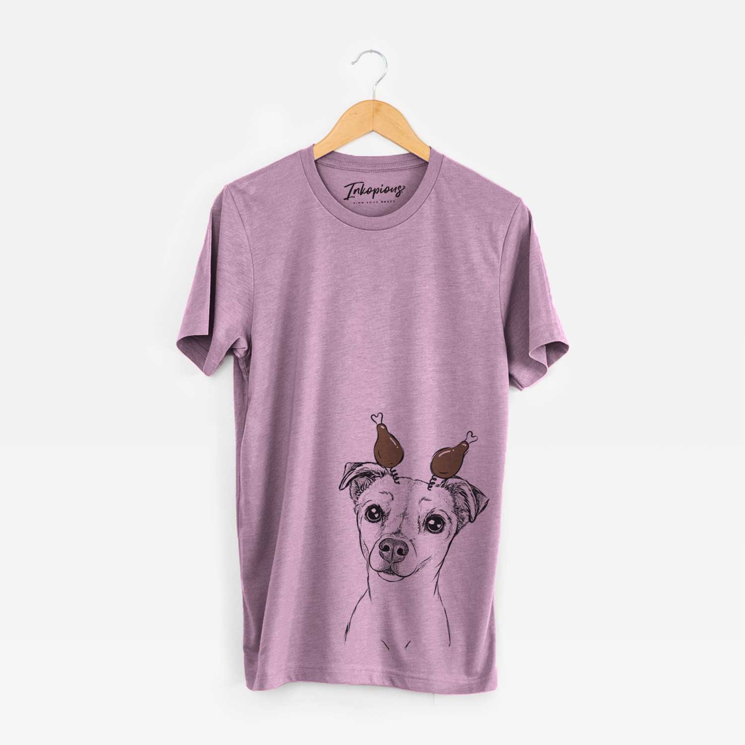 Hand-drawn sketch of Izzy the Chiweenie with a Thanksgiving turkey headpiece on an Orchid Unisex crewneck