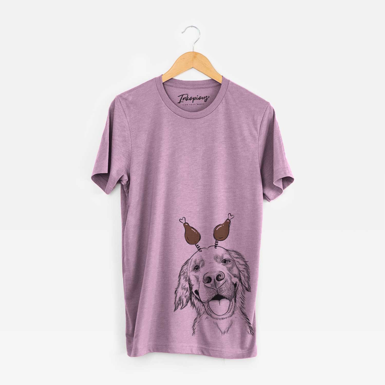 Hand-drawn sketch of Jordy the Golden Retriever with a Thanksgiving turkey headpiece on an Orchid Unisex crewneck