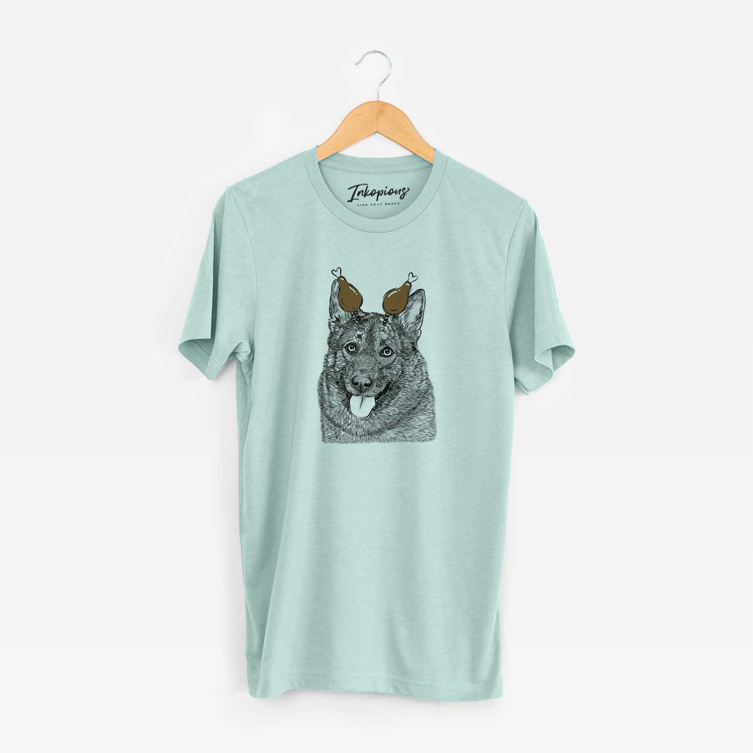 Hand-drawn sketch of Kasia the Norwegian Elkhound with a Thanksgiving turkey headpiece on a Heather Sage Unisex crewneck