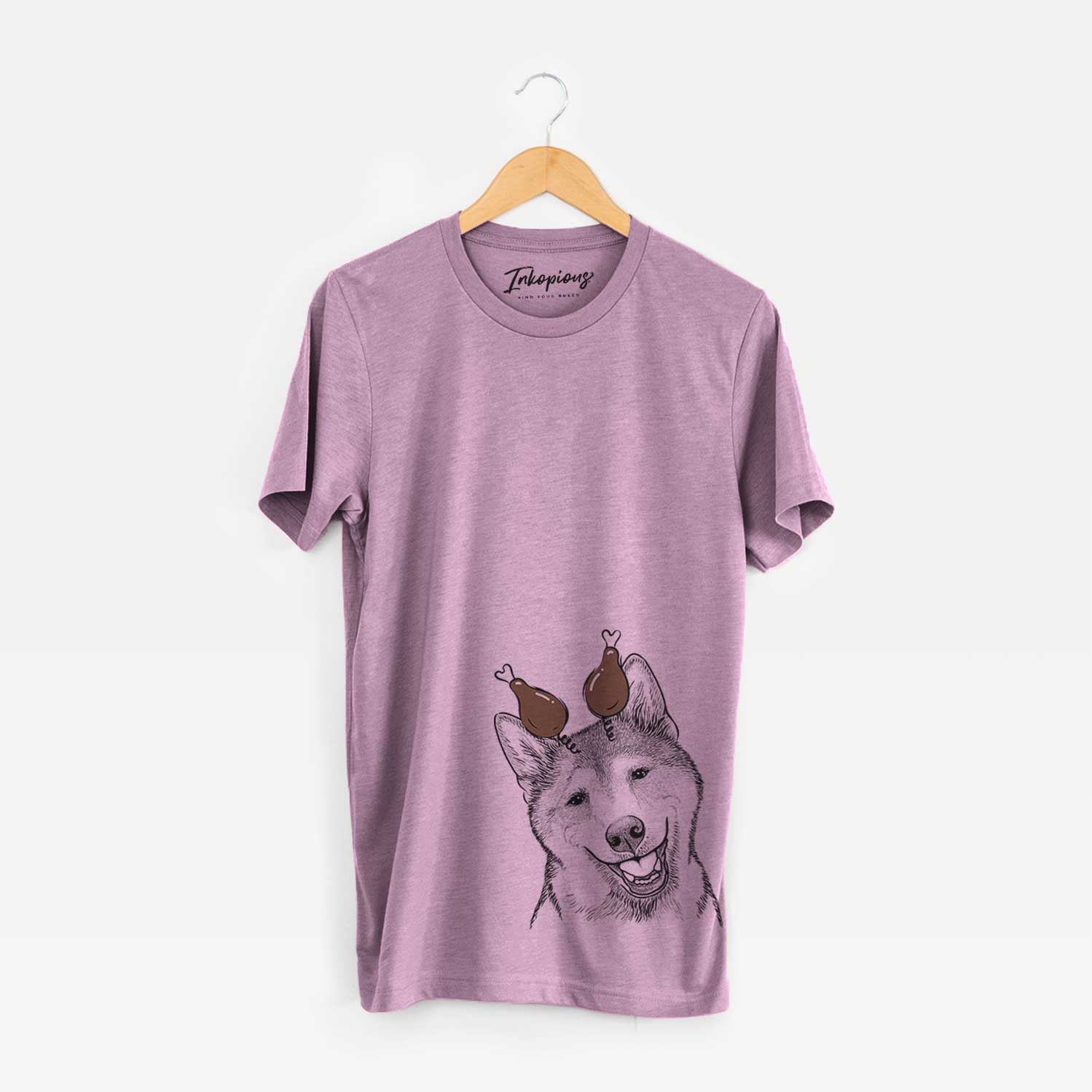 Hand-drawn sketch of Koby the Shiba Inu with a Thanksgiving turkey headpiece on an Orchid Unisex crewneck
