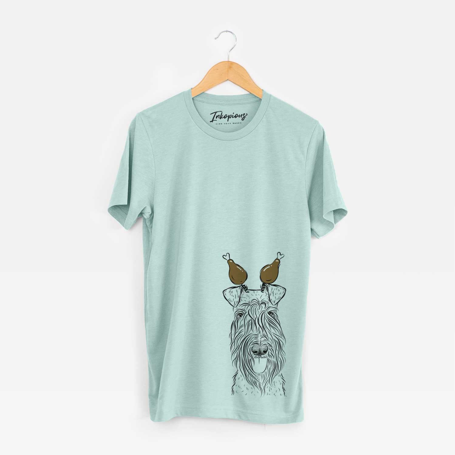 Hand-drawn sketch of Kricket the Kerry Blue Terrier with a Thanksgiving turkey headpiece on a Heather Sage Unisex crewneck