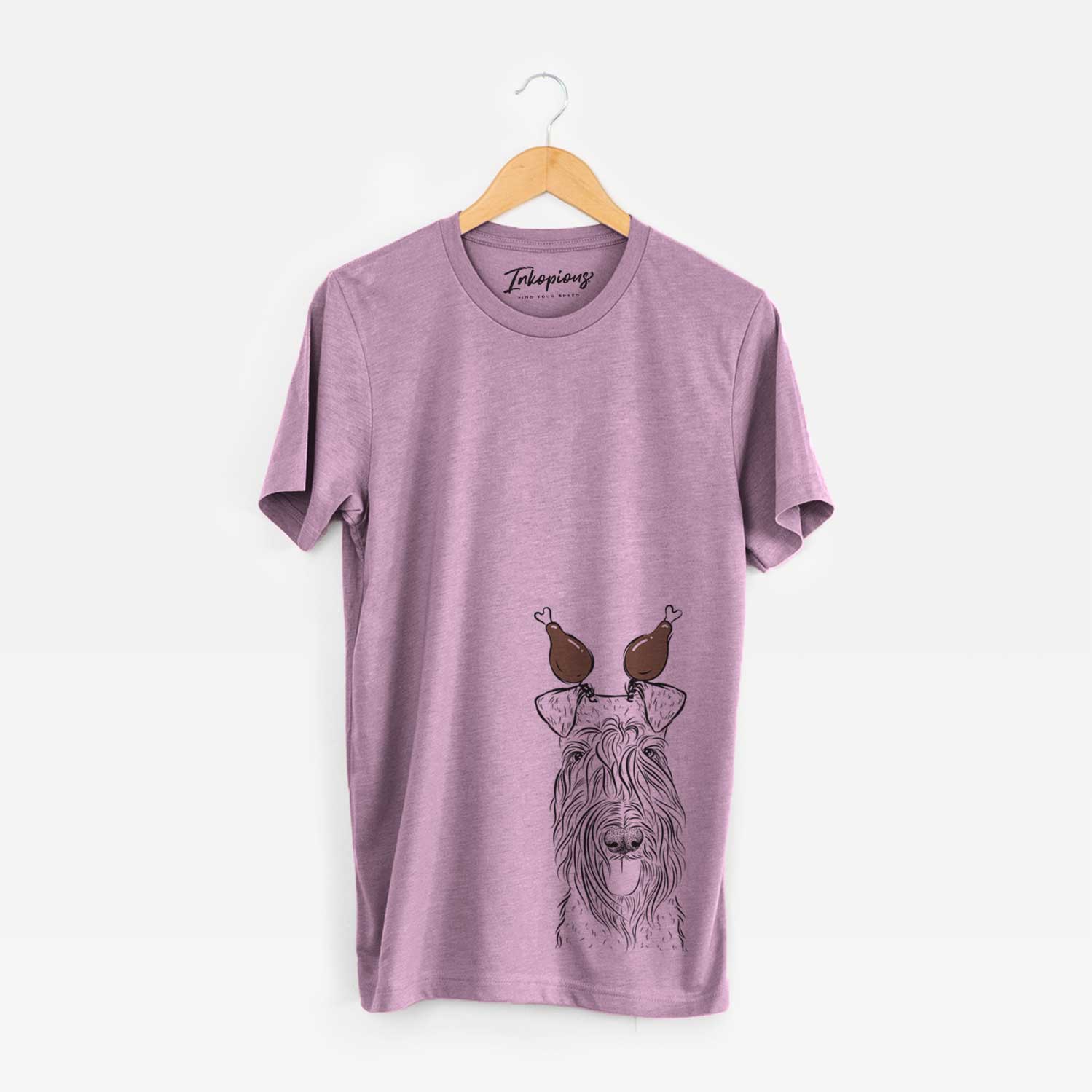 Hand-drawn sketch of Kricket the Kerry Blue Terrier with a Thanksgiving turkey headpiece on an Orchid Unisex crewneck