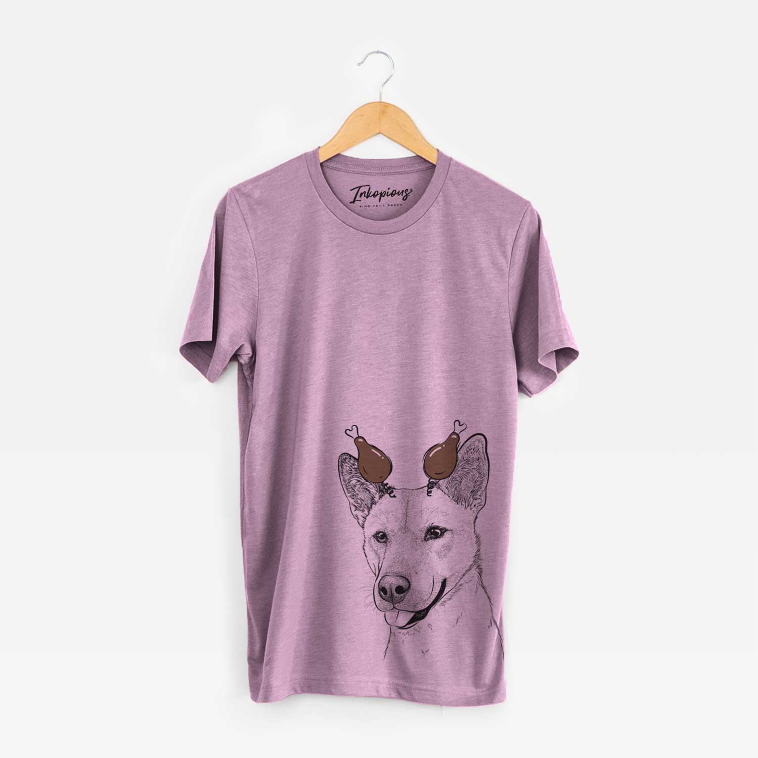 Hand-drawn sketch of Kulfi the Jindo Shiba Inu Mix with a Thanksgiving turkey headpiece on an Orchid Unisex crewneck