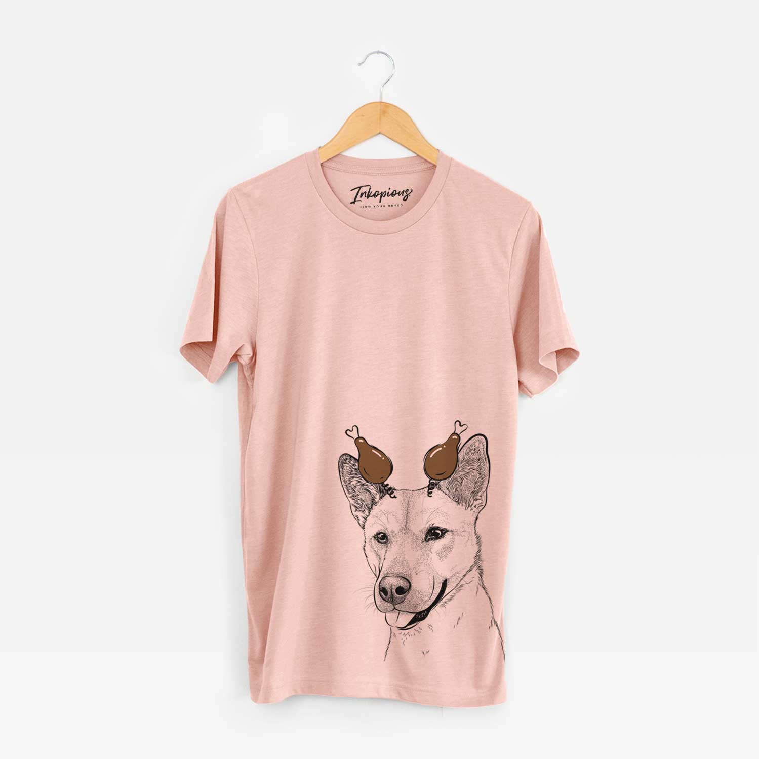 Hand-drawn sketch of Kulfi the Jindo Shiba Inu Mix with a Thanksgiving turkey headpiece on a Peach Unisex crewneck