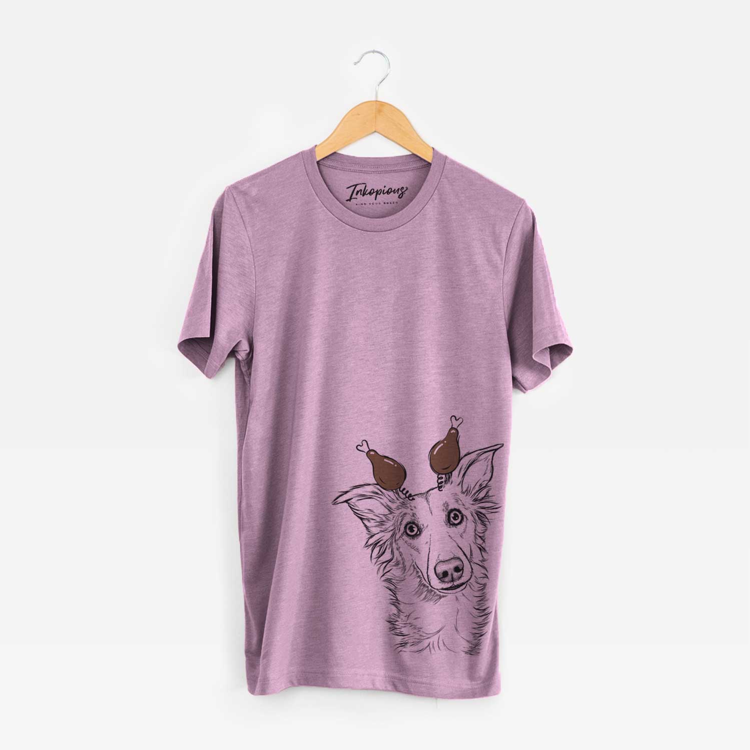 Hand-drawn sketch of Kyu the Windsprite with a Thanksgiving turkey headpiece on an Orchid Unisex crewneck