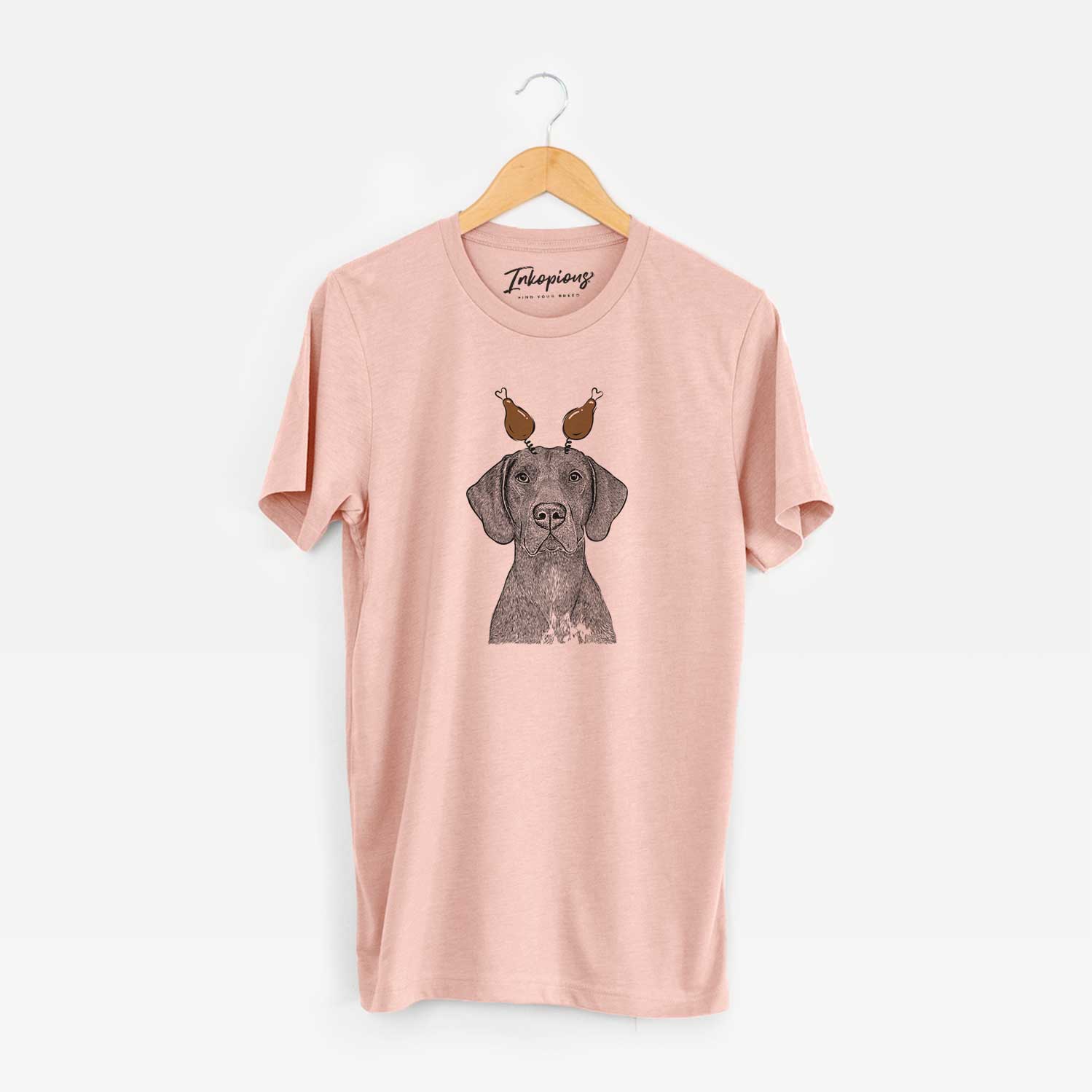 Hand-drawn sketch of Lucifer the German Shorthaired Pointer with a Thanksgiving turkey headpiece on a Peach Unisex crewneck