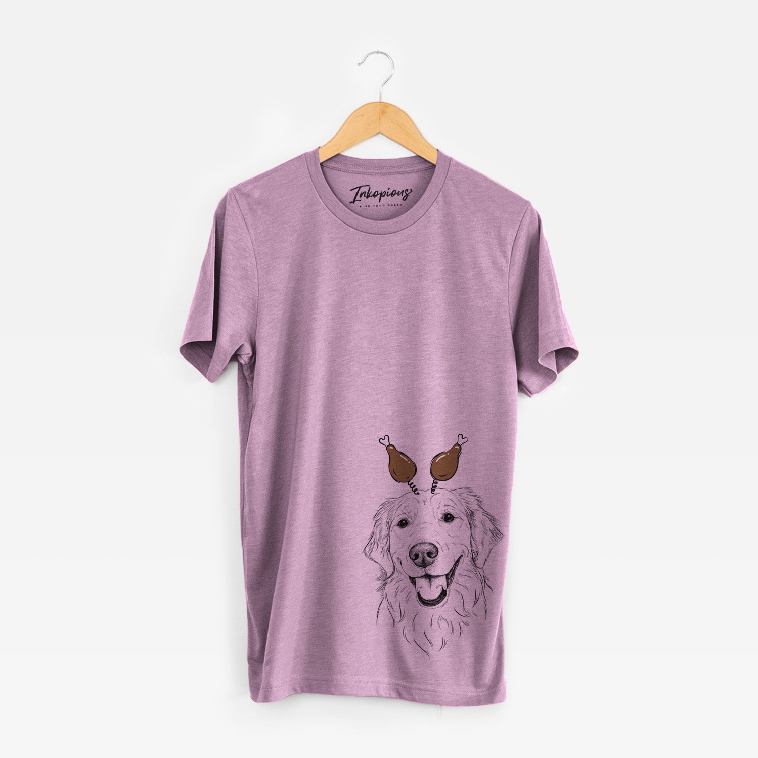 Hand-drawn sketch of Maple the Golden Retriever with a Thanksgiving turkey headpiece on an Orchid Unisex crewneck