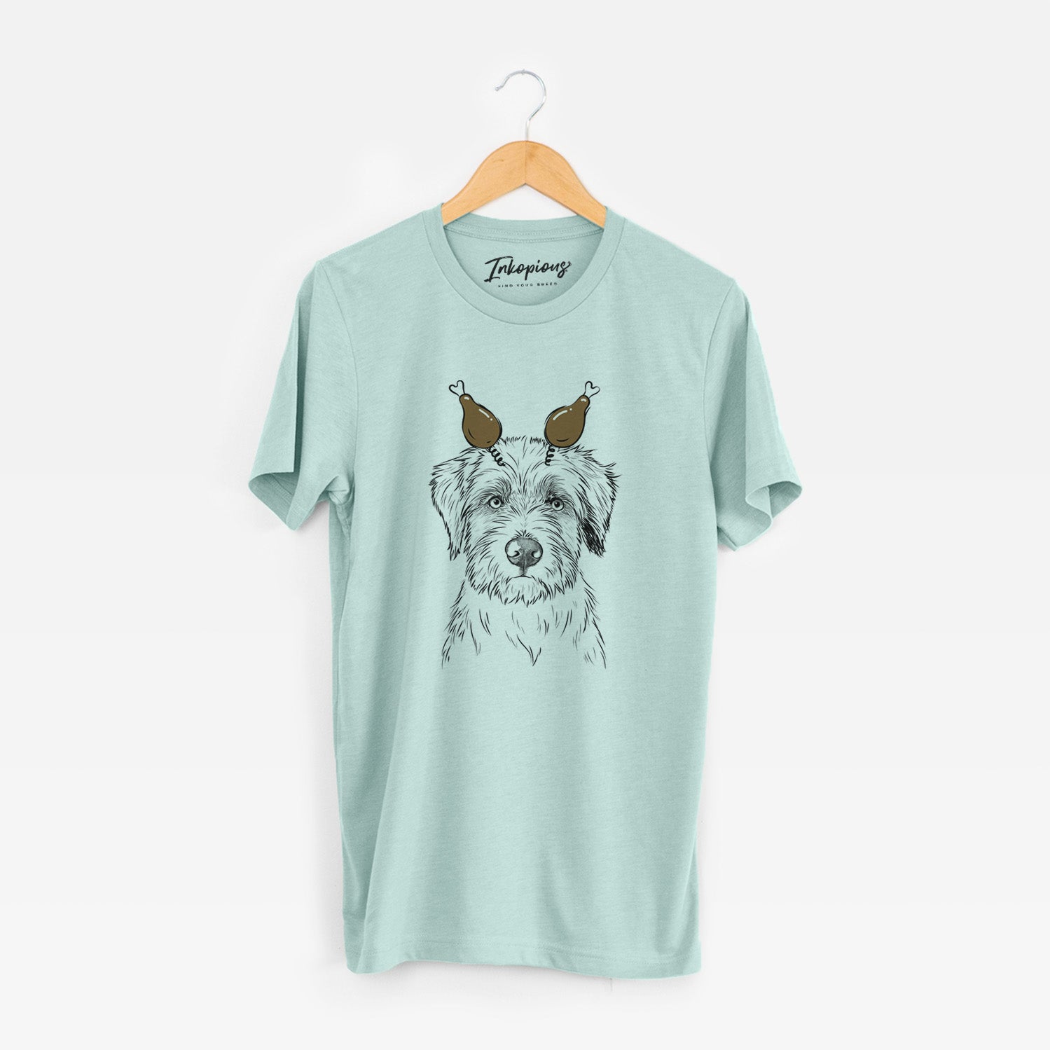 Hand-drawn sketch of Marek the Bernedoodle with a Thanksgiving turkey headpiece on a Heather Sage Unisex crewneck