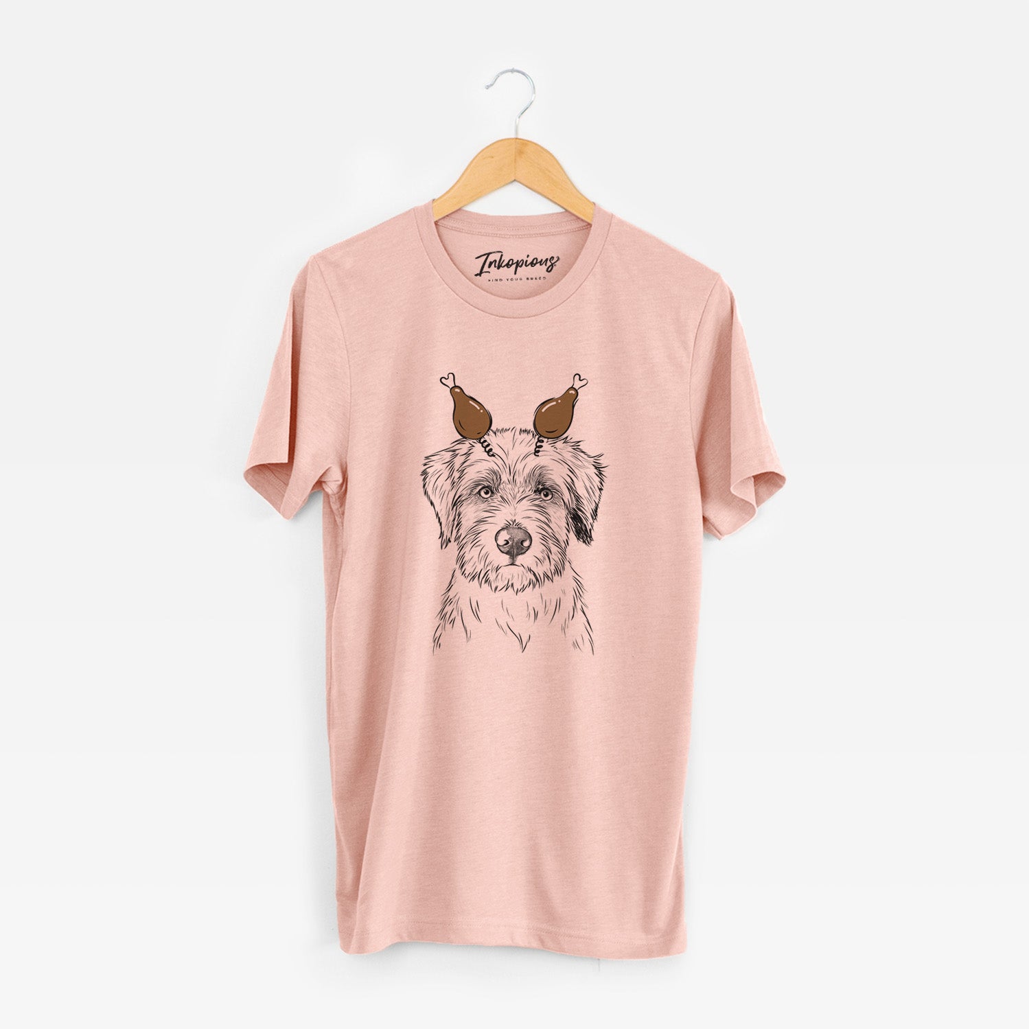 Hand-drawn sketch of Marek the Bernedoodle with a Thanksgiving turkey headpiece on a Peach Unisex crewneck