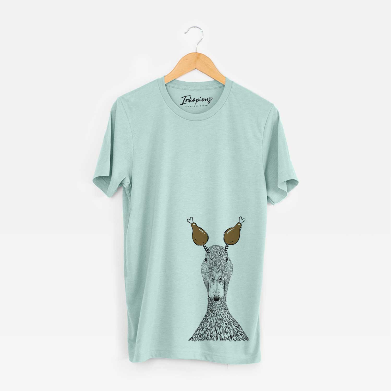 Hand-drawn sketch of Marge the Mallard Duck with a Thanksgiving turkey headpiece on a Heather Sage Unisex crewneck