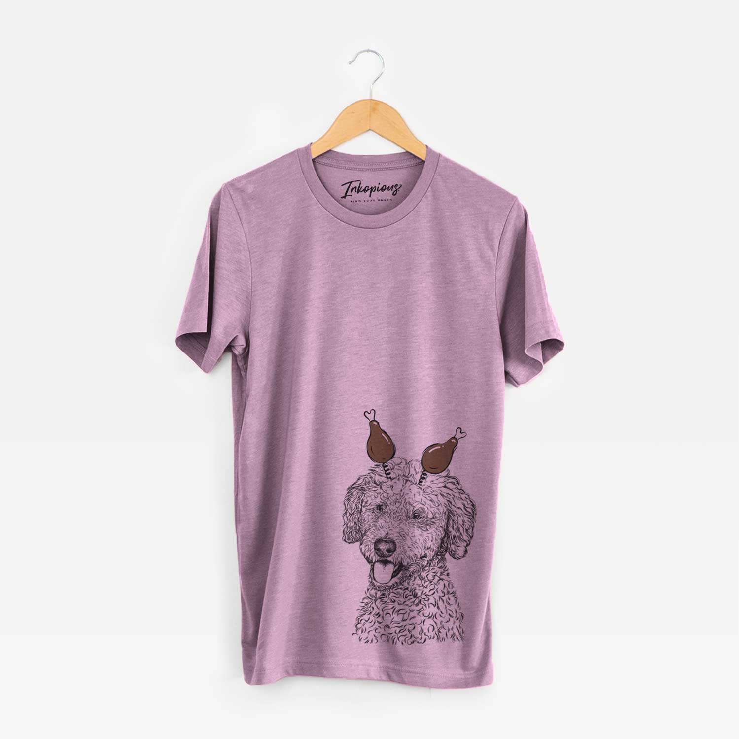 Hand-drawn sketch of Marlow the Goldendoodle with a Thanksgiving turkey headpiece on an Orchid Unisex crewneck