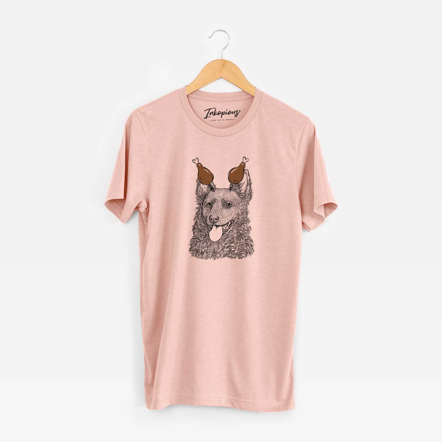 Hand-drawn sketch of Maximo the Mudi with a Thanksgiving turkey headpiece on a Peach Unisex crewneck