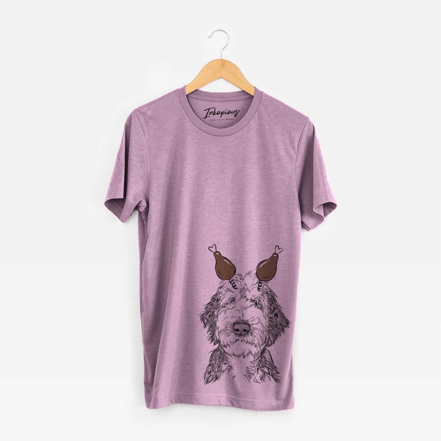 Hand-drawn sketch of Milo Fluff the Sheepadoodle with a Thanksgiving turkey headpiece on an Orchid Unisex crewneck