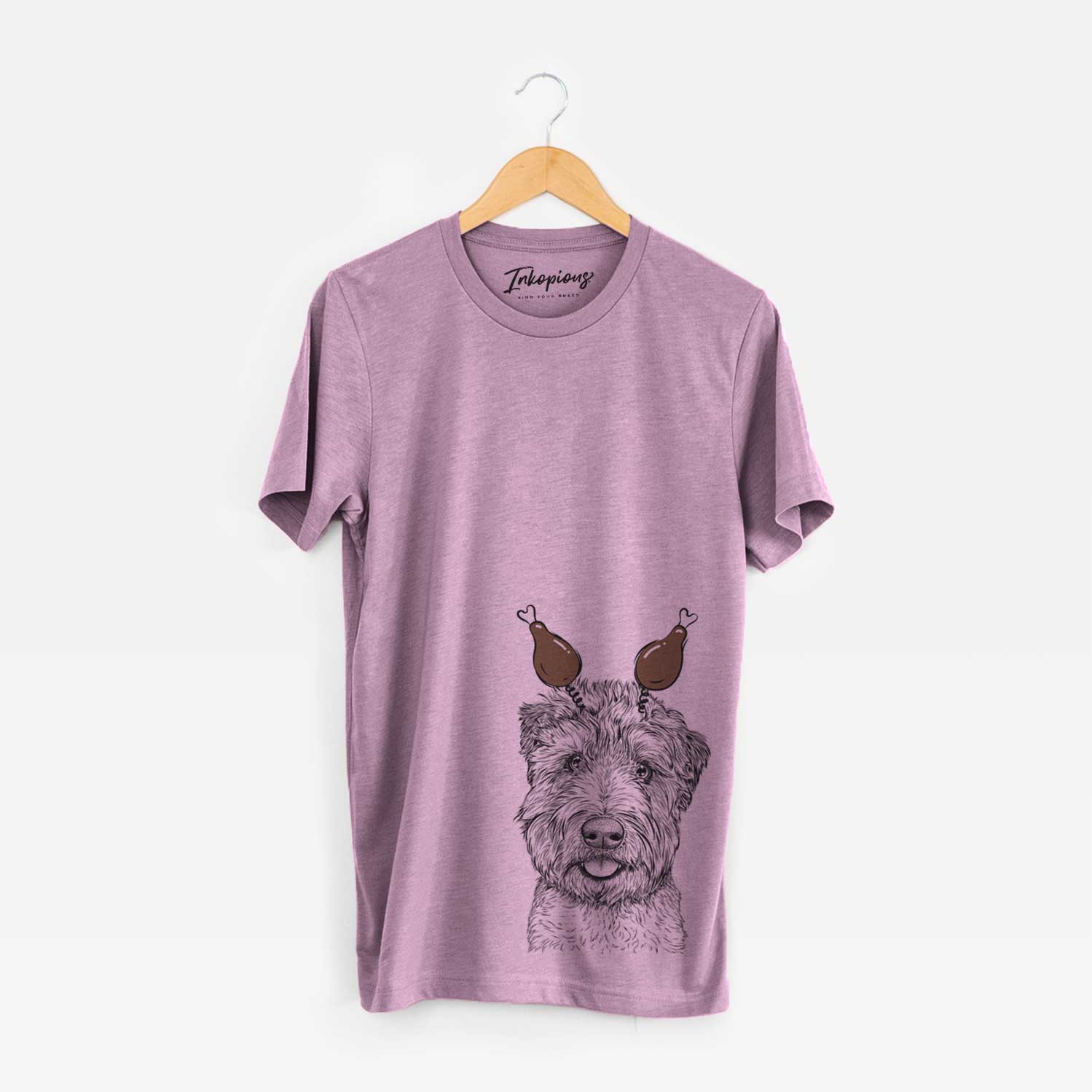 Hand-drawn sketch of Milton the Soft Coated Wheaten Terrier with a Thanksgiving turkey headpiece on an Orchid Unisex crewneck