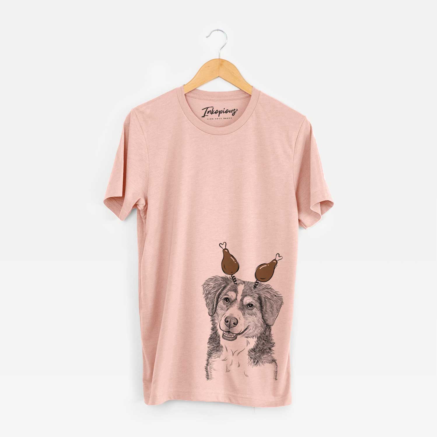Hand-drawn sketch of Molly the Miniature Bernedoodle with a Thanksgiving turkey headpiece on a Peach Unisex crewneck