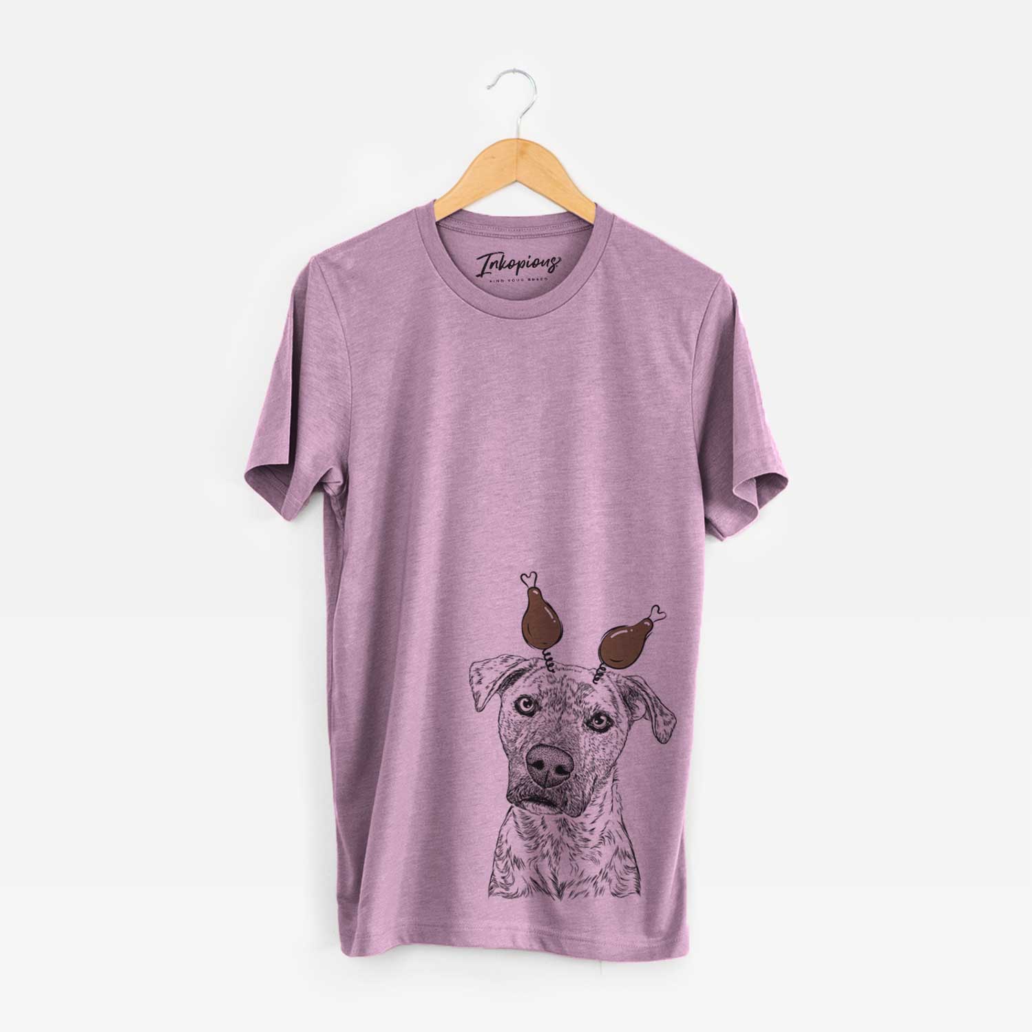 Hand-drawn sketch of Monster Baby the Pitbull Mix with a Thanksgiving turkey headpiece on an Orchid Unisex crewneck