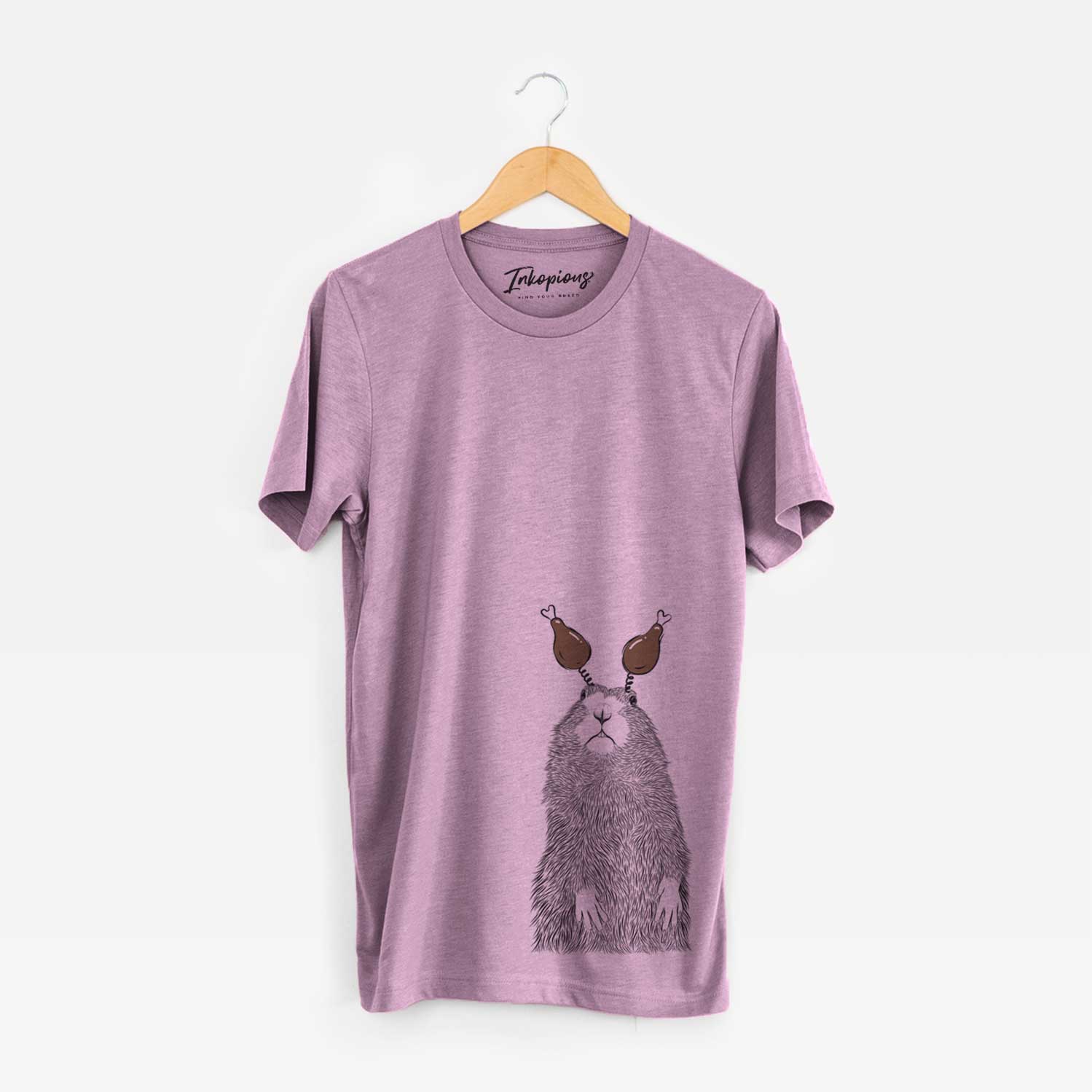Hand-drawn sketch of Mr. Otis the Prairie Dog with a Thanksgiving turkey headpiece on an Orchid Unisex crewneck