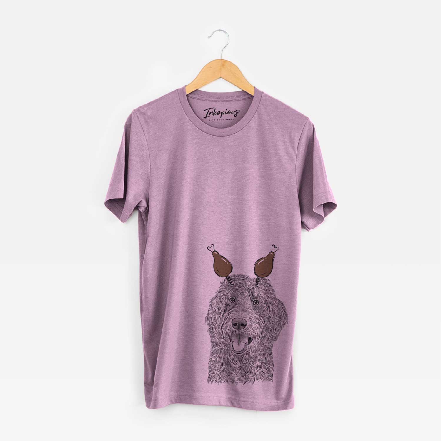 Hand-drawn sketch of Murr Dog the Labradoodle with a Thanksgiving turkey headpiece on an Orchid Unisex crewneck
