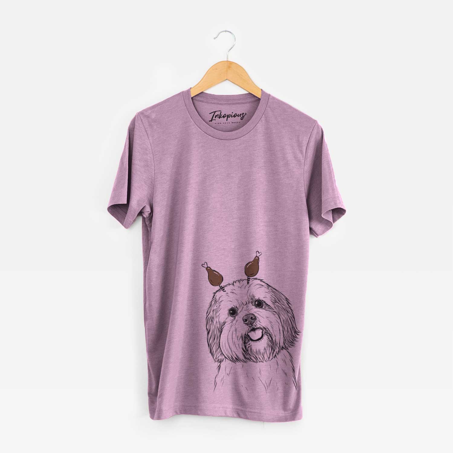 Hand-drawn sketch of Nikka the Lowchen with a Thanksgiving turkey headpiece on an Orchid Unisex crewneck