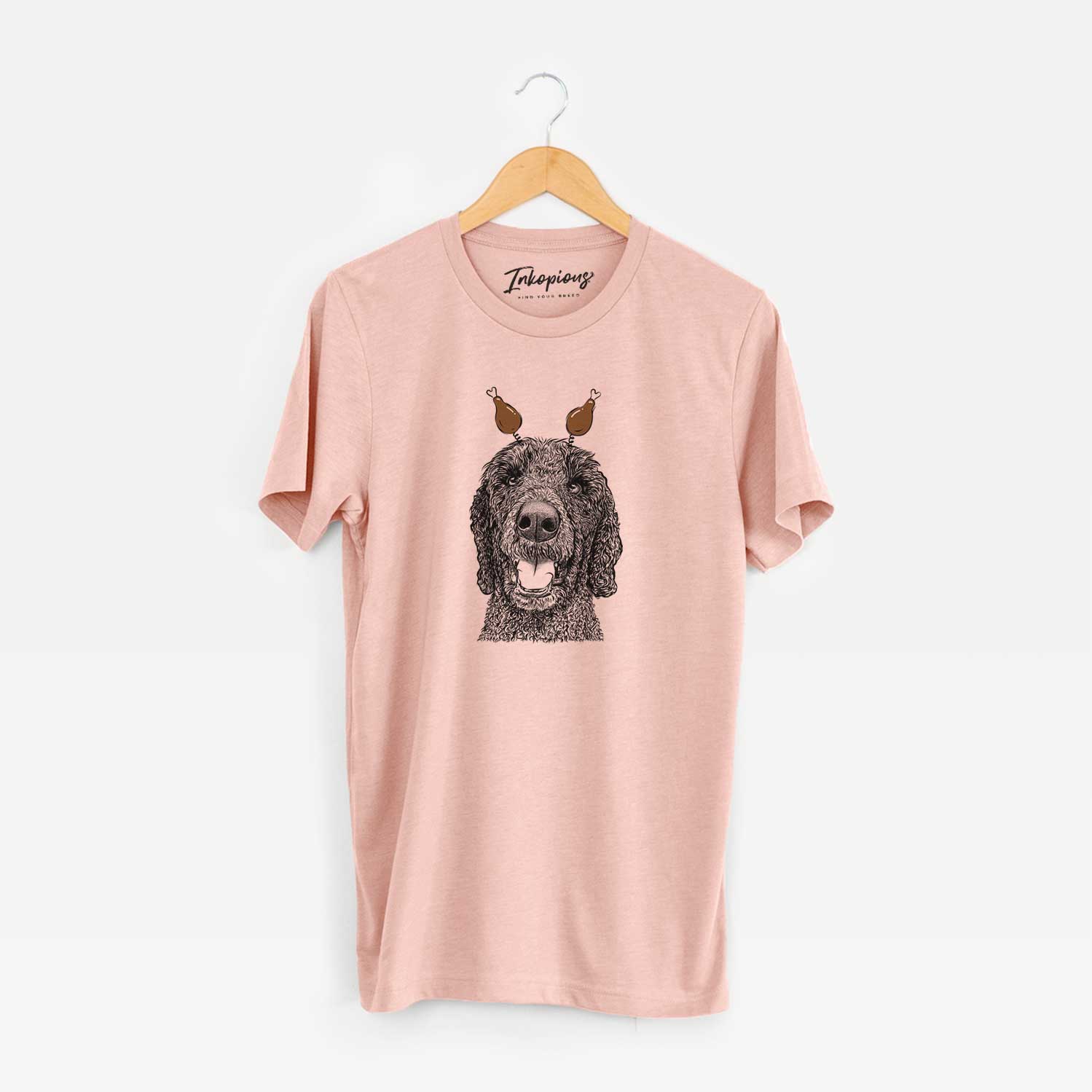 Hand-drawn sketch of Obi James the Goldendoodle with a Thanksgiving turkey headpiece on a Peach Unisex crewneck