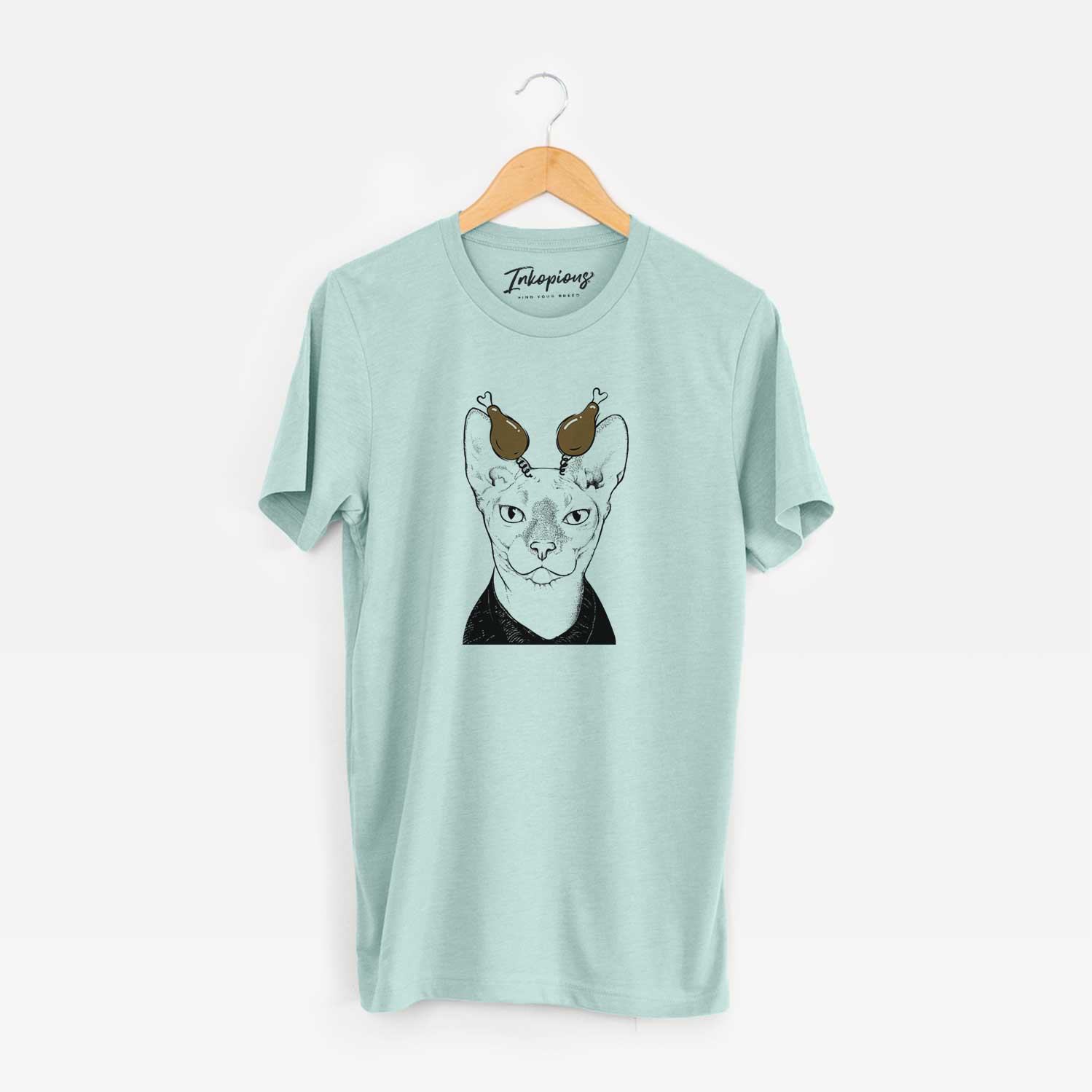 Hand-drawn sketch of Oliver Watson the Sphynx Cat with a Thanksgiving turkey headpiece on a Heather Sage Unisex crewneck