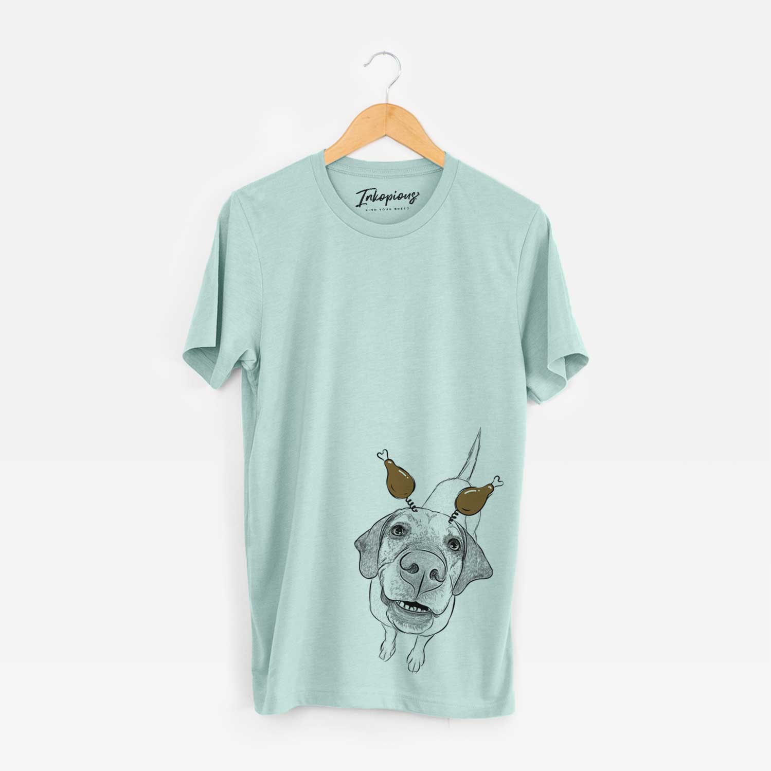 Hand-drawn sketch of Oquirrh the Vizsla with a Thanksgiving turkey headpiece on a Heather Sage Unisex crewneck