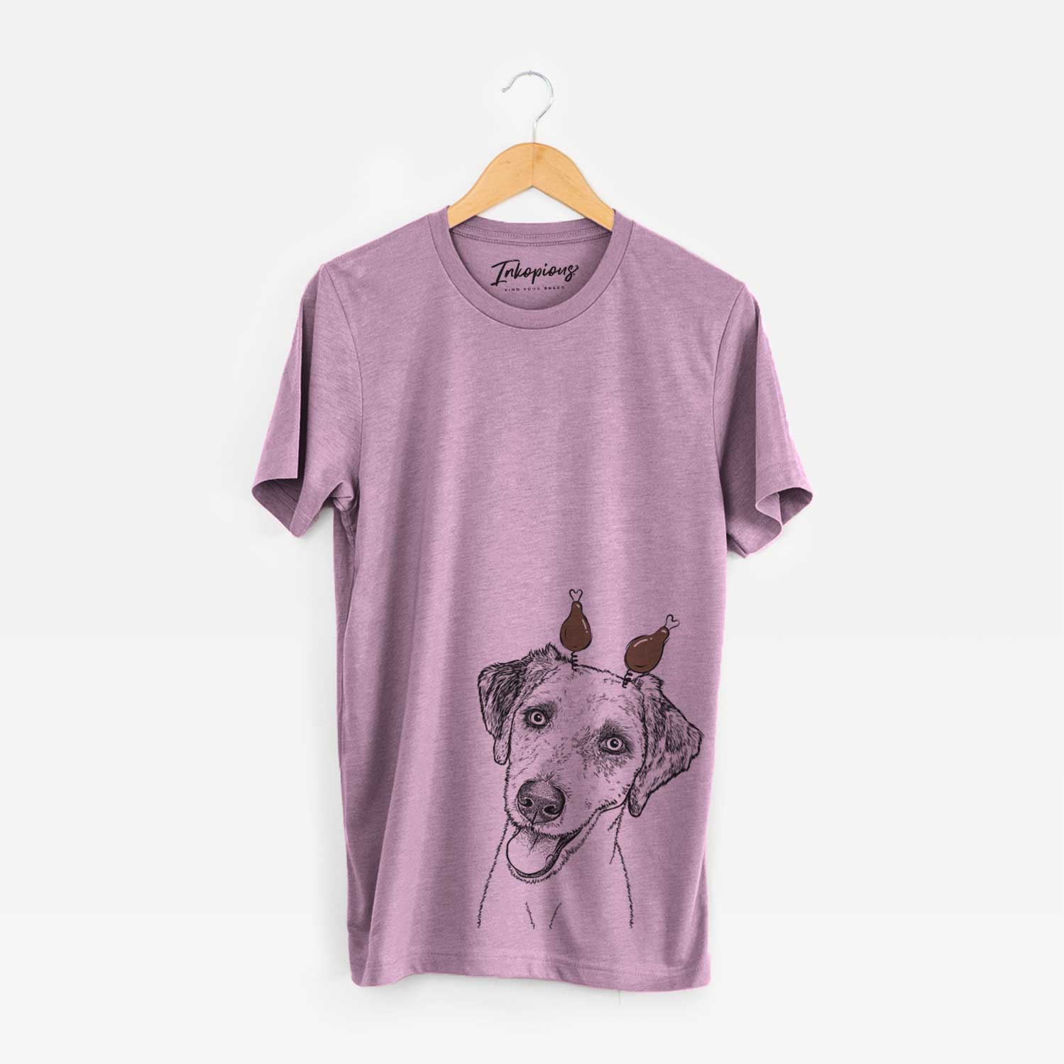 Hand-drawn sketch of Palm Palm the Aussiedoodle with a Thanksgiving turkey headpiece on an Orchid Unisex crewneck