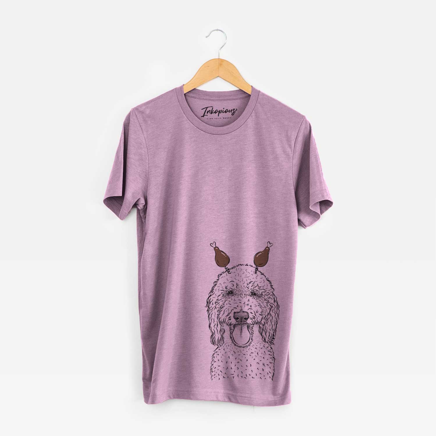 Hand-drawn sketch of Pavlov the Goldendoodle with a Thanksgiving turkey headpiece on an Orchid Unisex crewneck