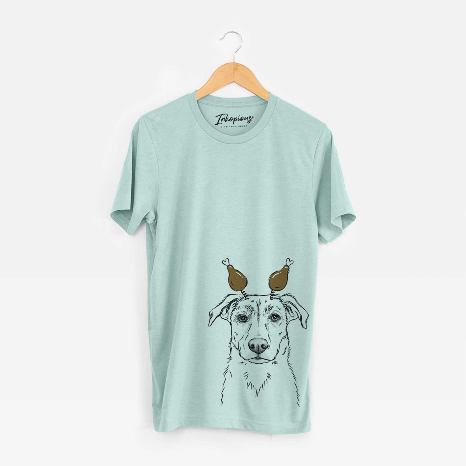 Hand-drawn sketch of Peanut the Lab Mix with a Thanksgiving turkey headpiece on a Heather Sage Unisex crewneck