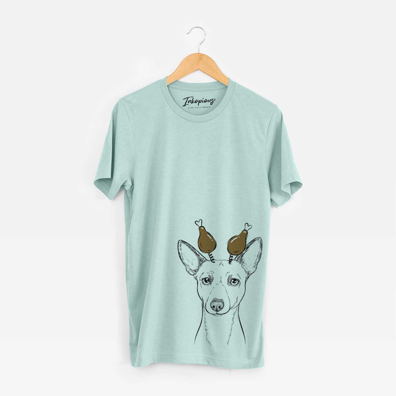 Hand-drawn sketch of Perry the Portuguese Podengo with a Thanksgiving turkey headpiece on a Heather Sage Unisex crewneck