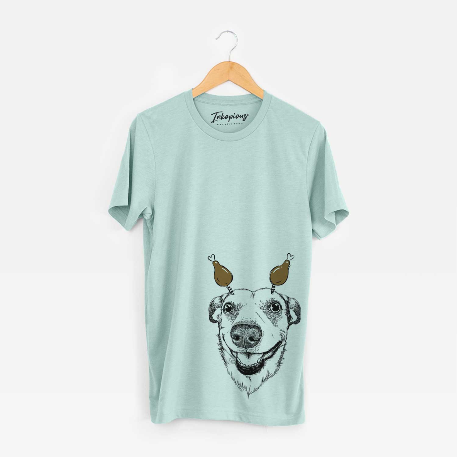 Hand-drawn sketch of Petrah the Staffy Mix with a Thanksgiving turkey headpiece on a Heather Sage Unisex crewneck