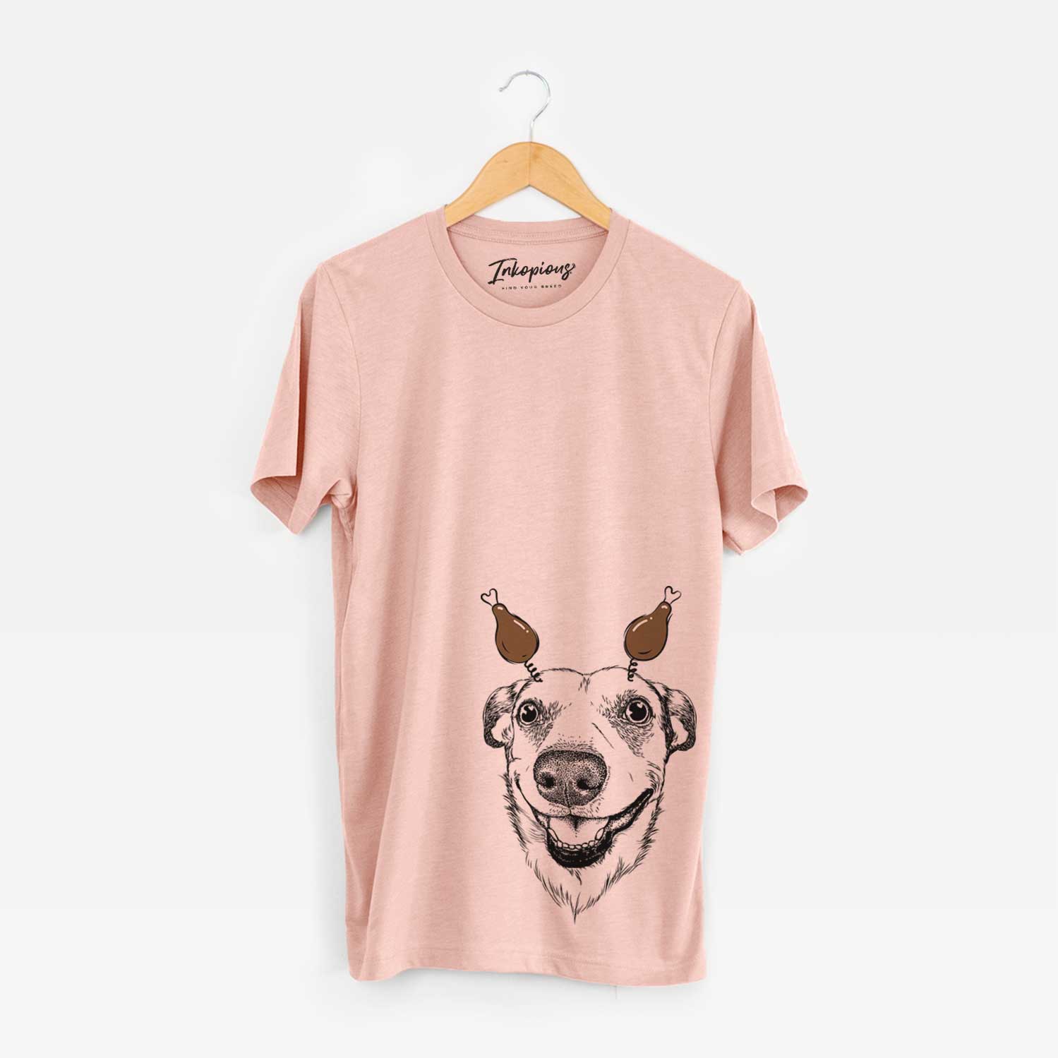 Hand-drawn sketch of Petrah the Staffy Mix with a Thanksgiving turkey headpiece on a Peach Unisex crewneck