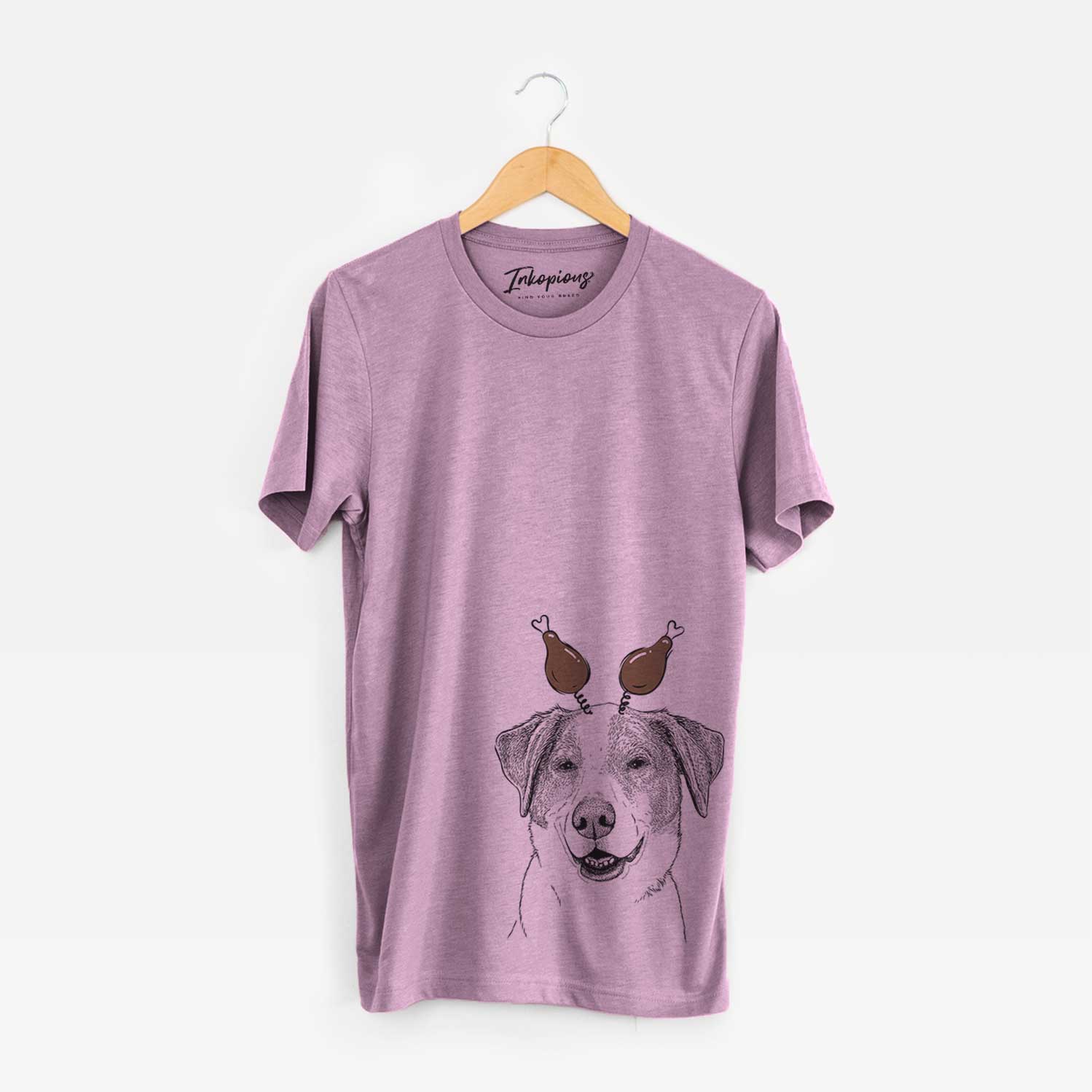 Hand-drawn sketch of Piper Pilot the Hound Mix with a Thanksgiving turkey headpiece on an Orchid Unisex crewneck