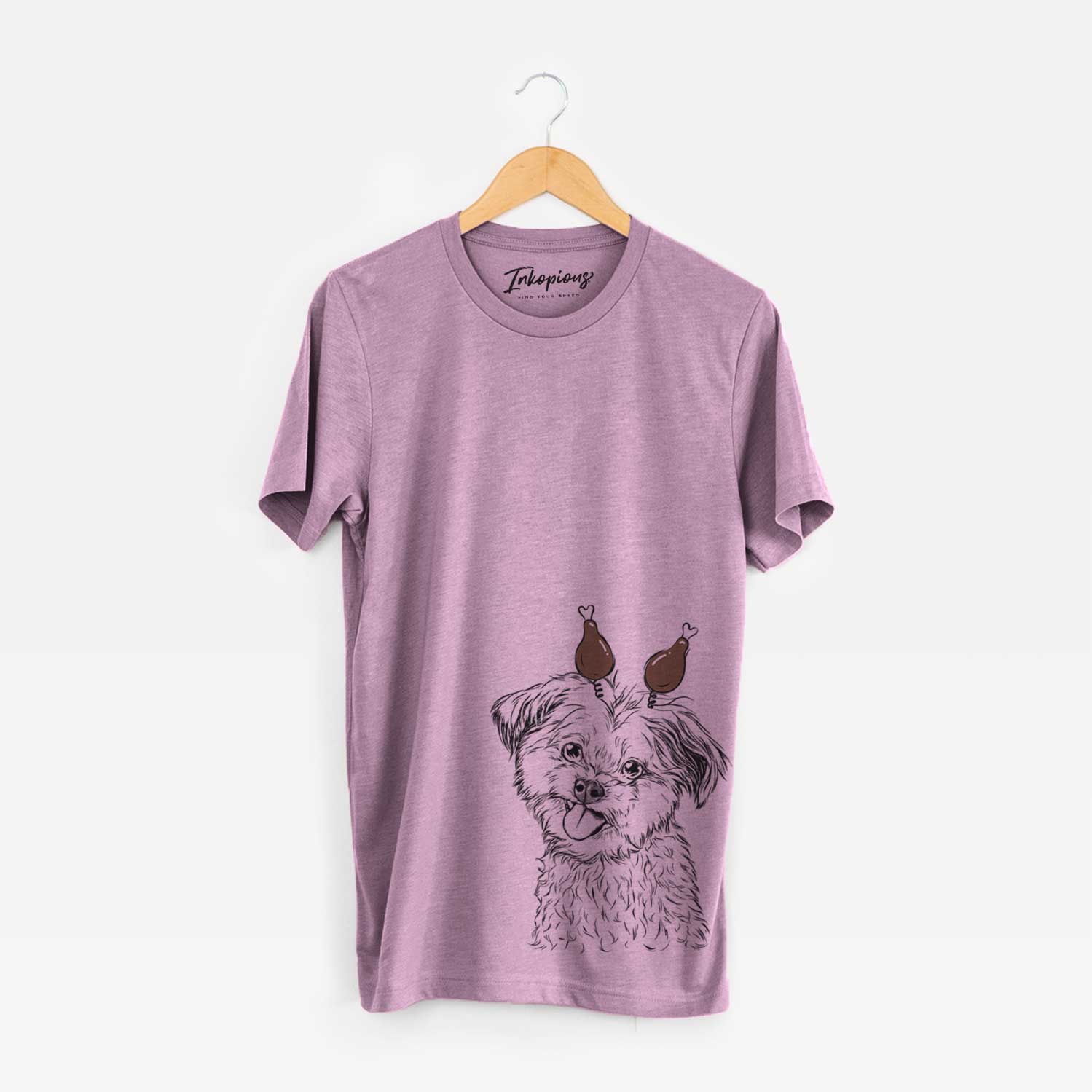 Hand-drawn sketch of Puff the Malshi with a Thanksgiving turkey headpiece on an Orchid Unisex crewneck