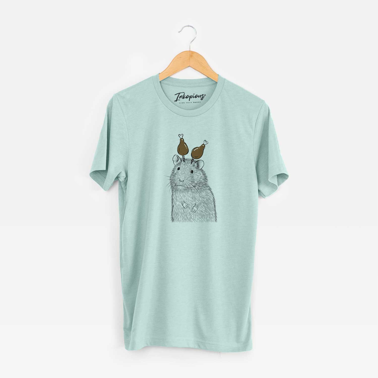 Hand-drawn sketch of Rizzo the Rat with a Thanksgiving turkey headpiece on a Heather Sage Unisex crewneck